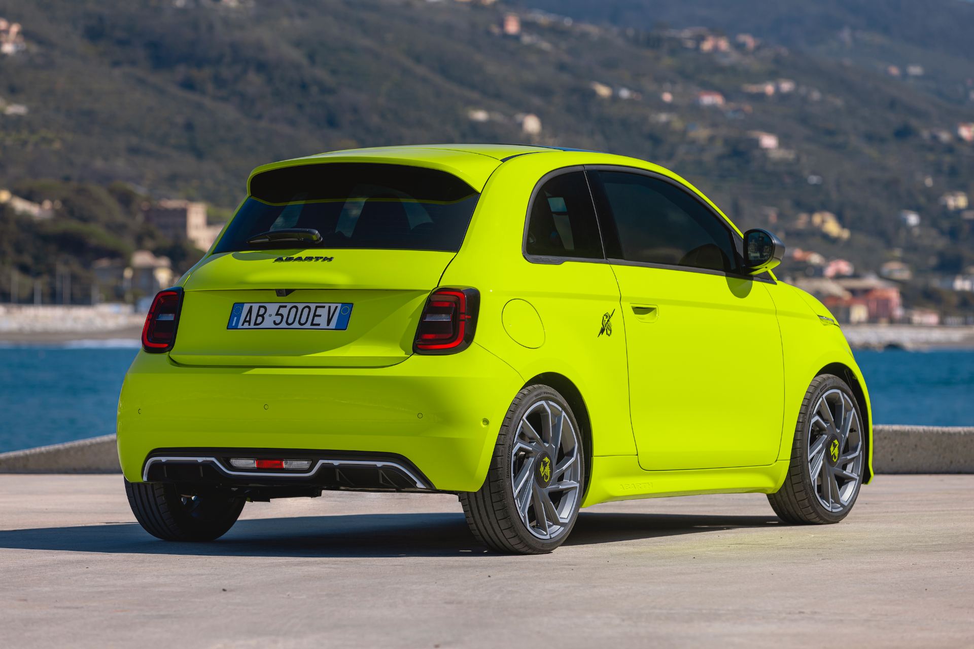 2024 abarth 500e rear three quarter green