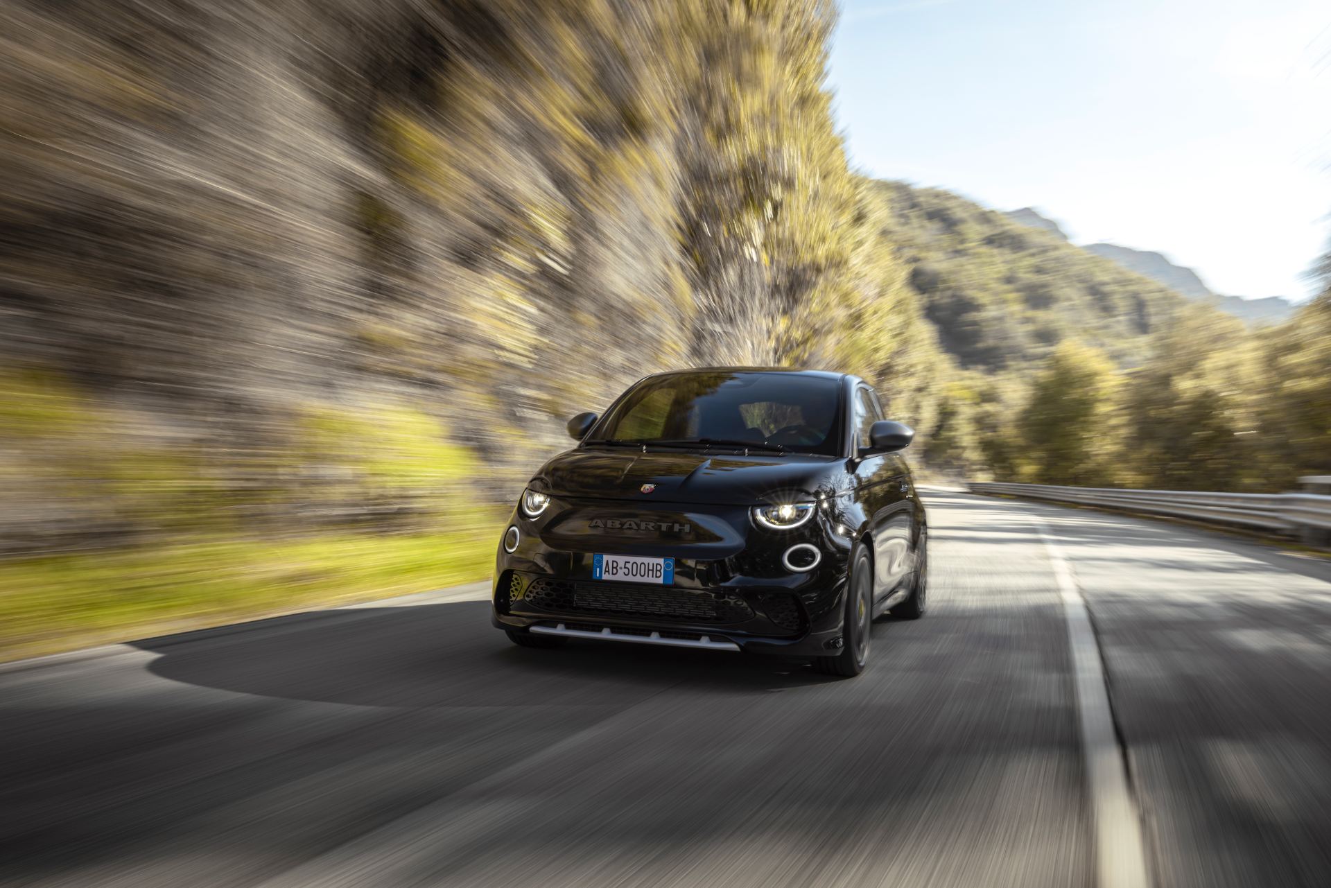 2024 abarth 500e driving front mountain road black
