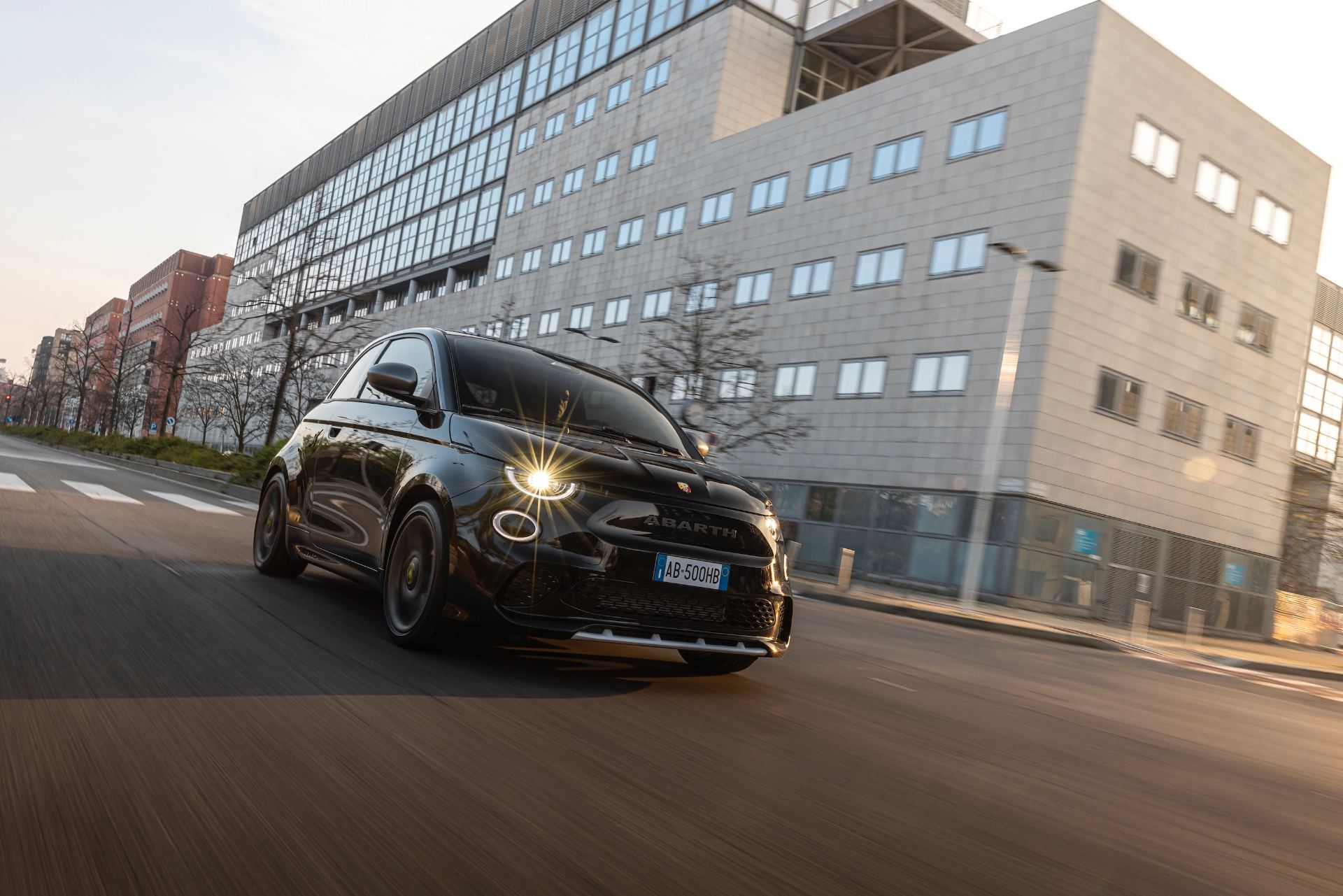 2024 abarth 500e driving front city black