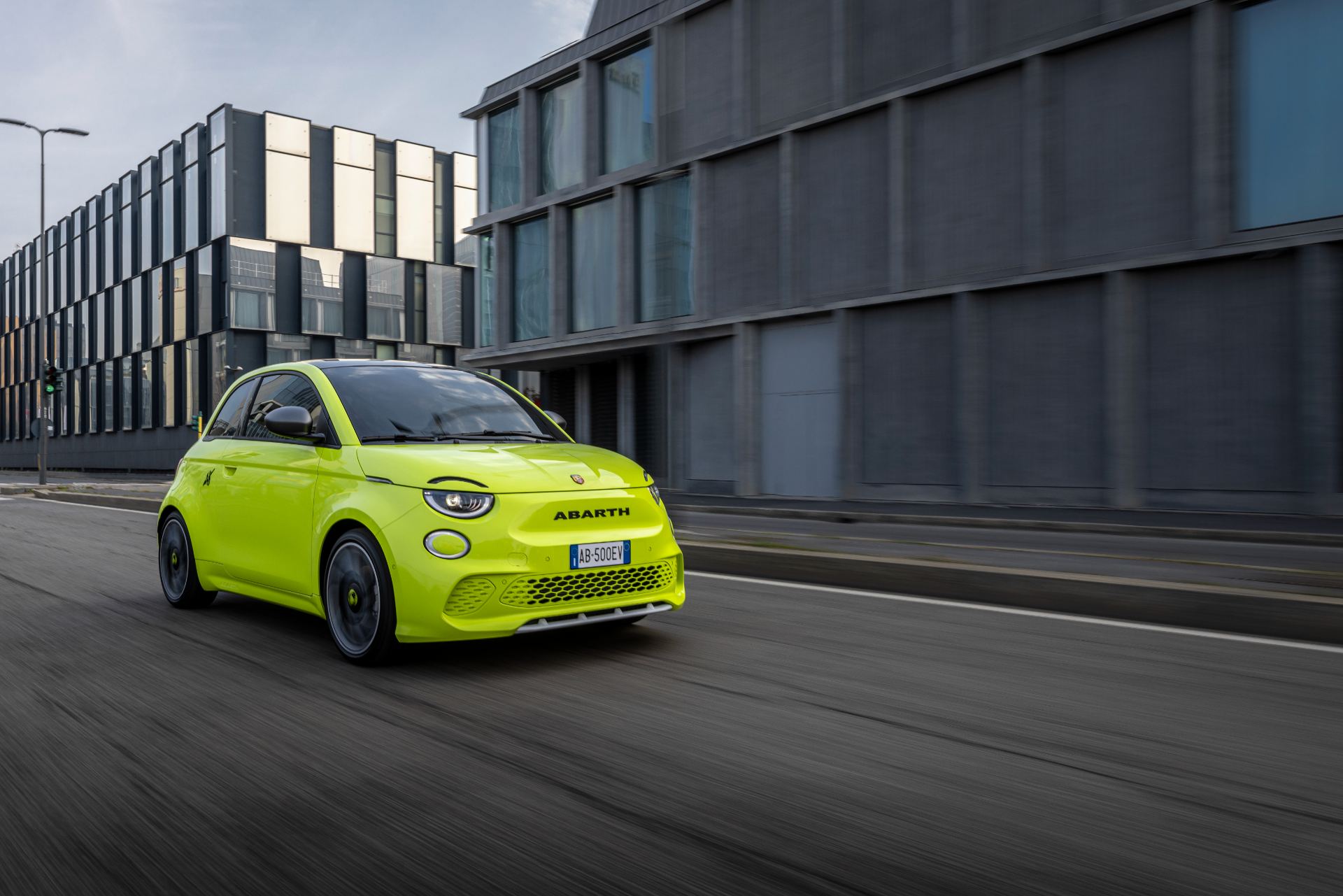 2024 abarth 500e driving front three quarter street green