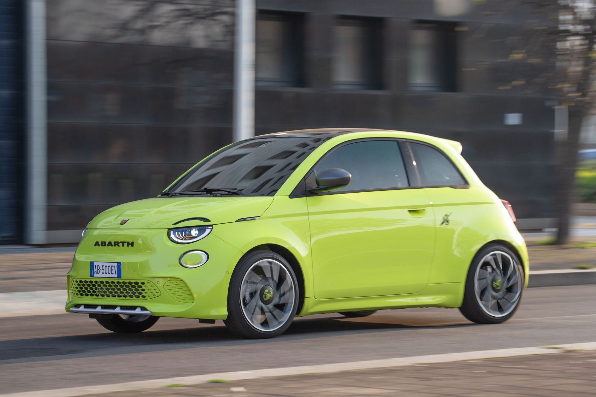 2024 abarth 500e driving front three quarter green