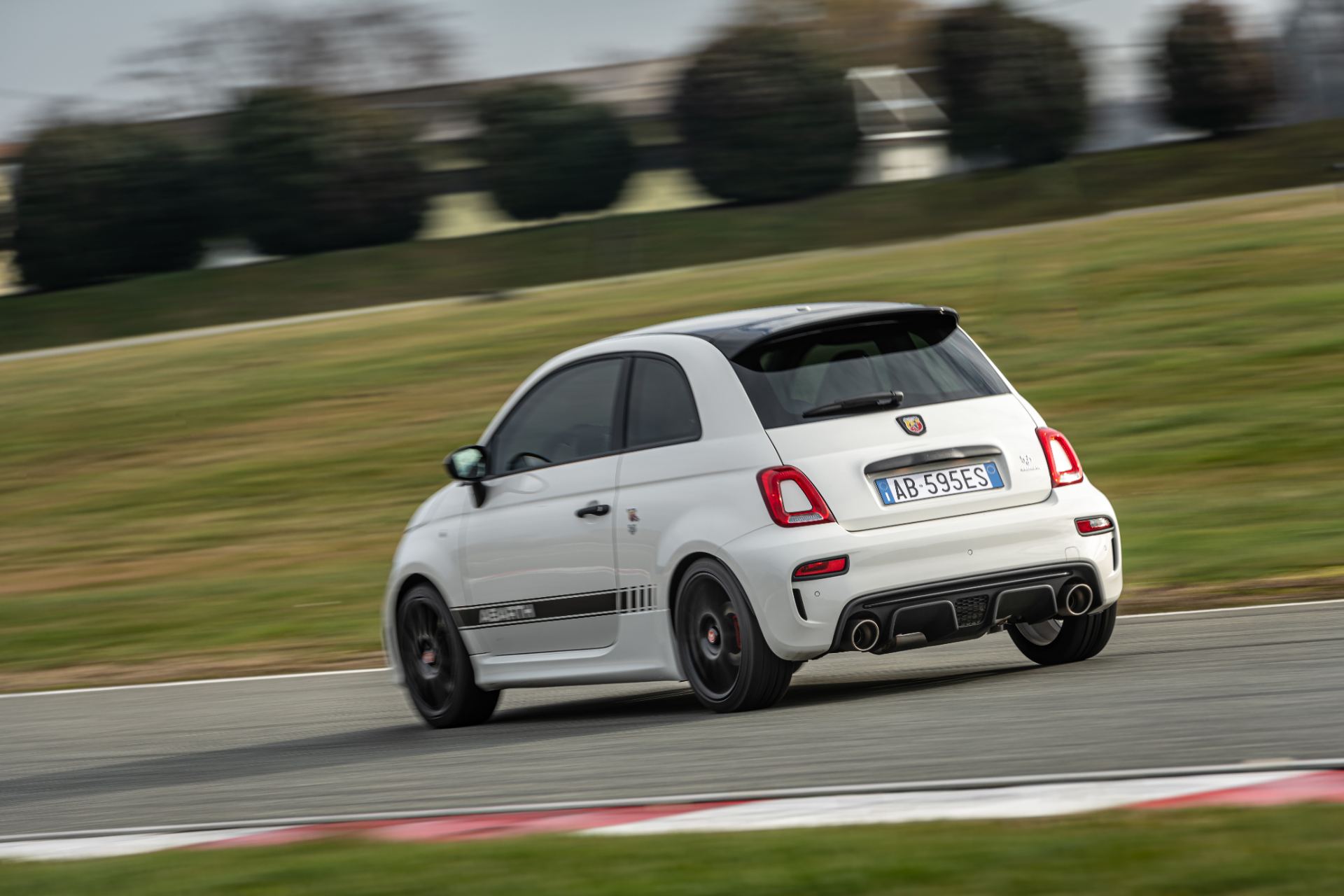 2021 abarth 595 driving rear three quarter track white