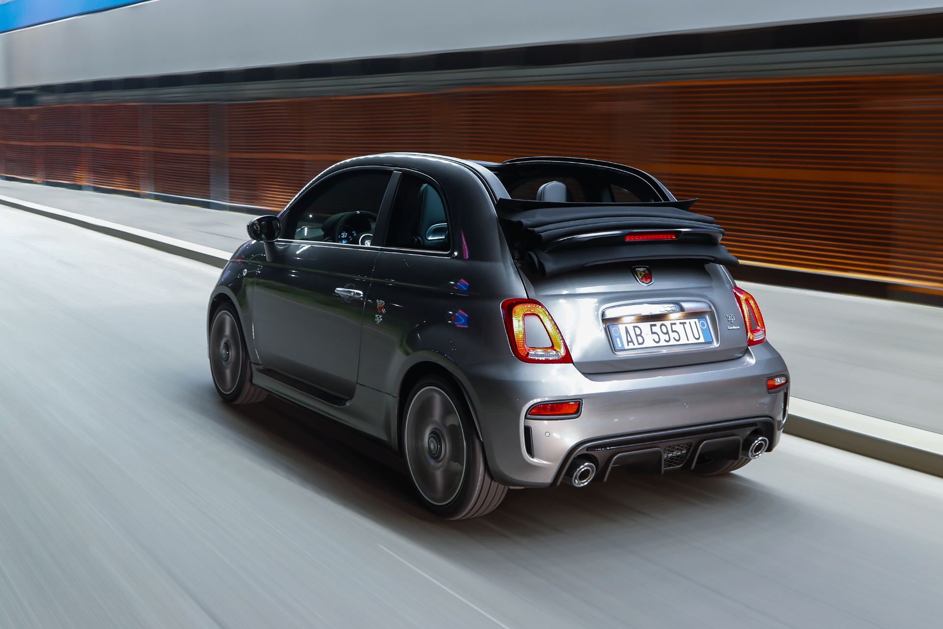 2021 abarth 595 driving rear three quarter convertible grey
