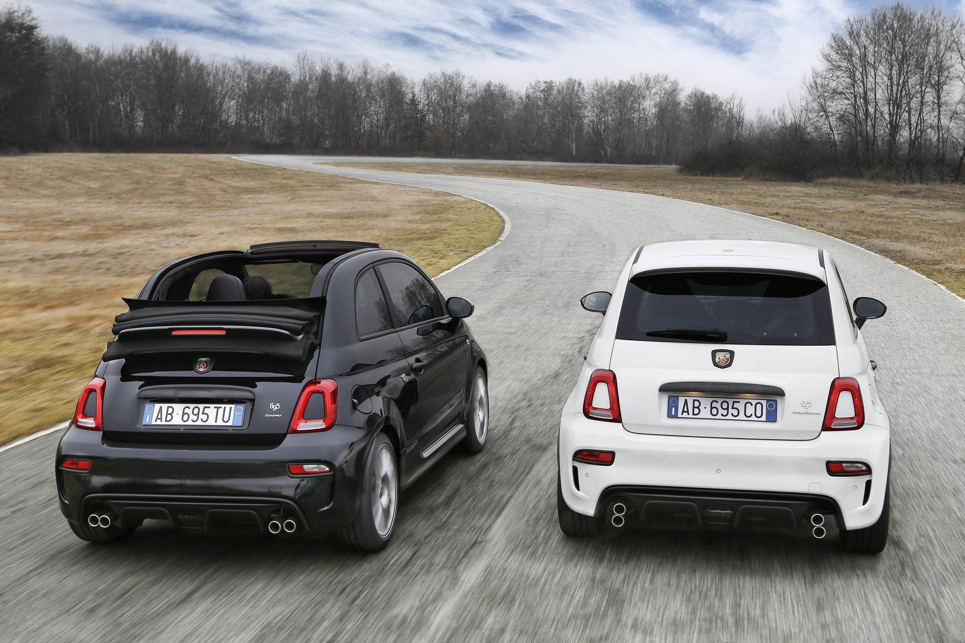 2024 abarth 695 lineup driving rear black and white