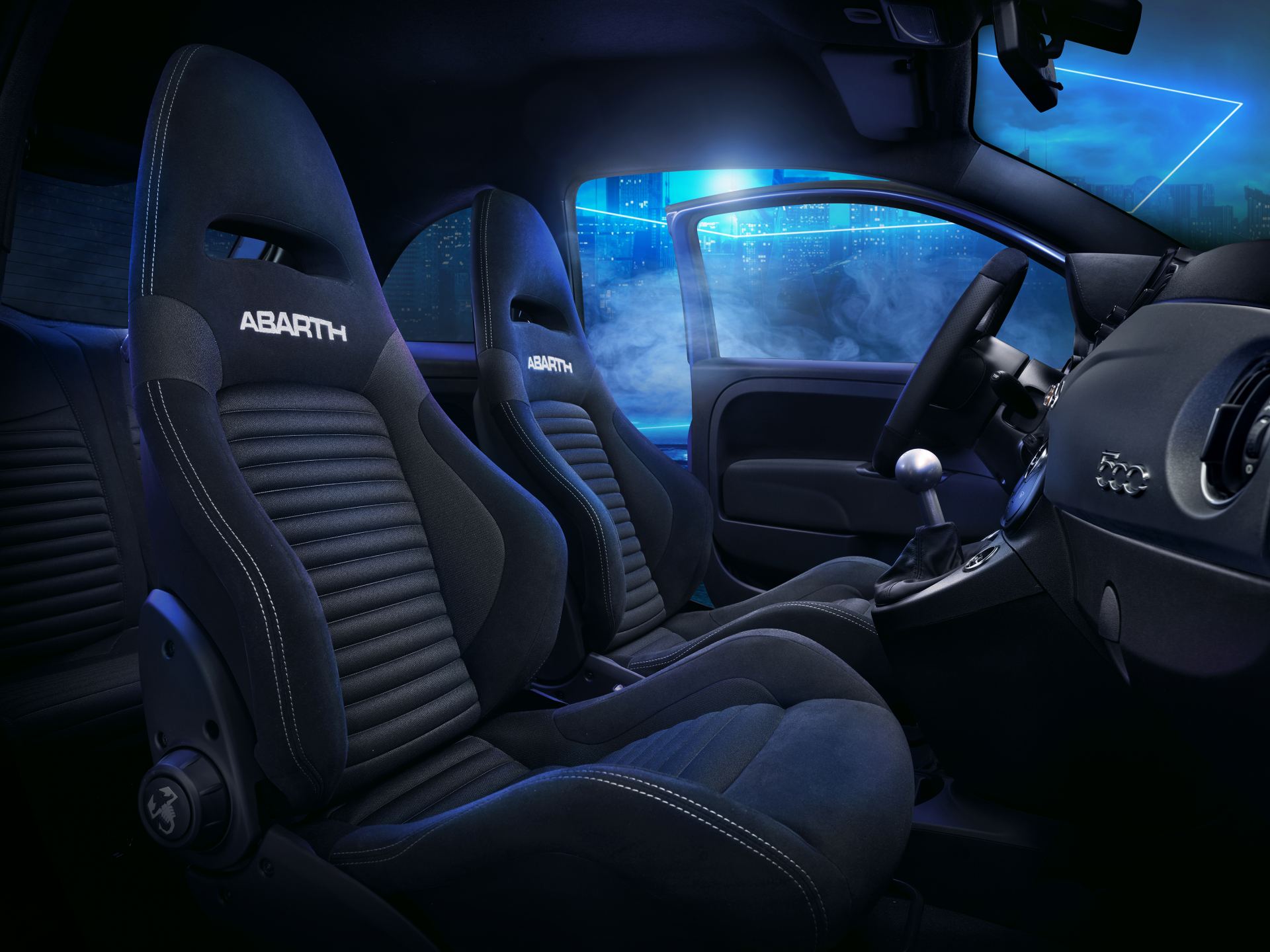 2024 abarth 695 interior front sport seats blue lighting