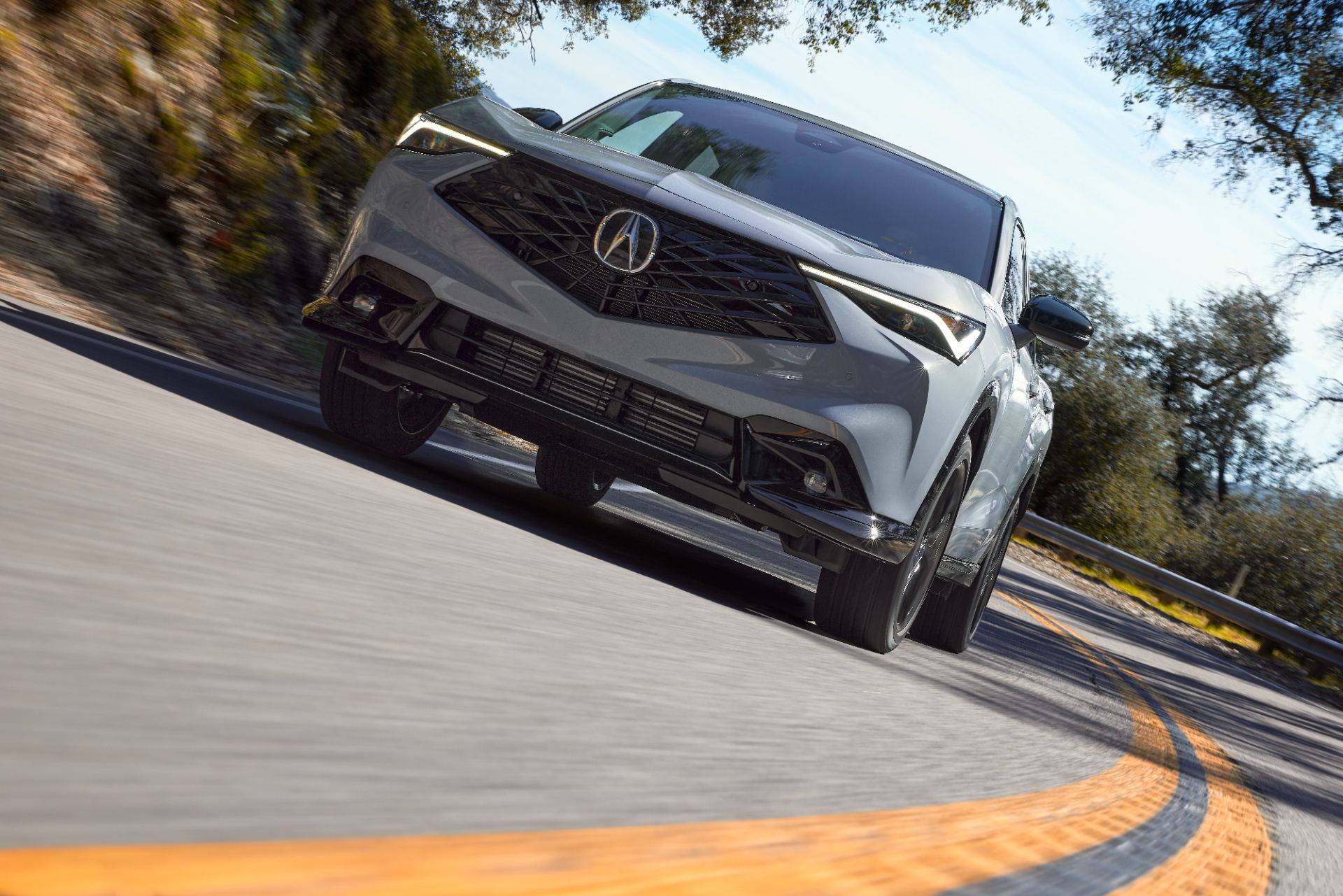 acura adx a spec driving front three quarter mountain road grey