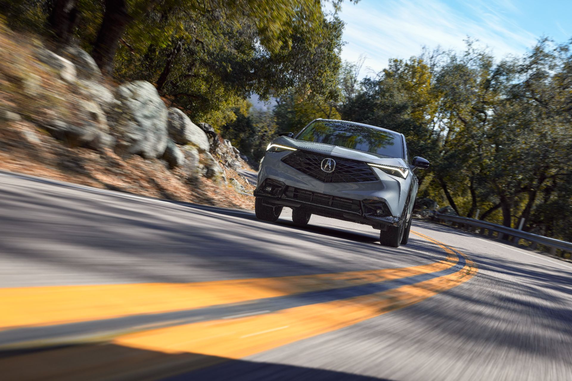 acura adx a spec driving front winding road grey