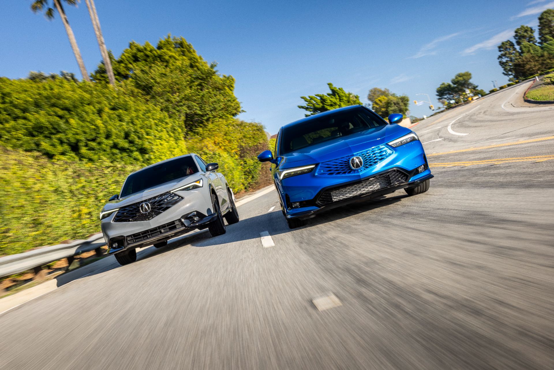 acura adx a spec and 2026 integra a spec driving grey and blue