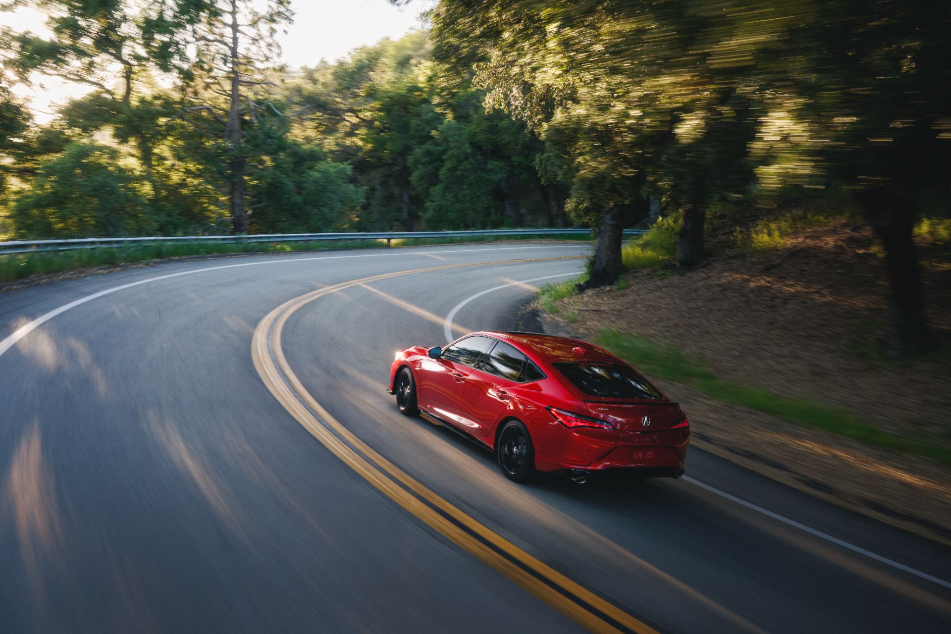 2026 acura integra a spec driving winding road red
