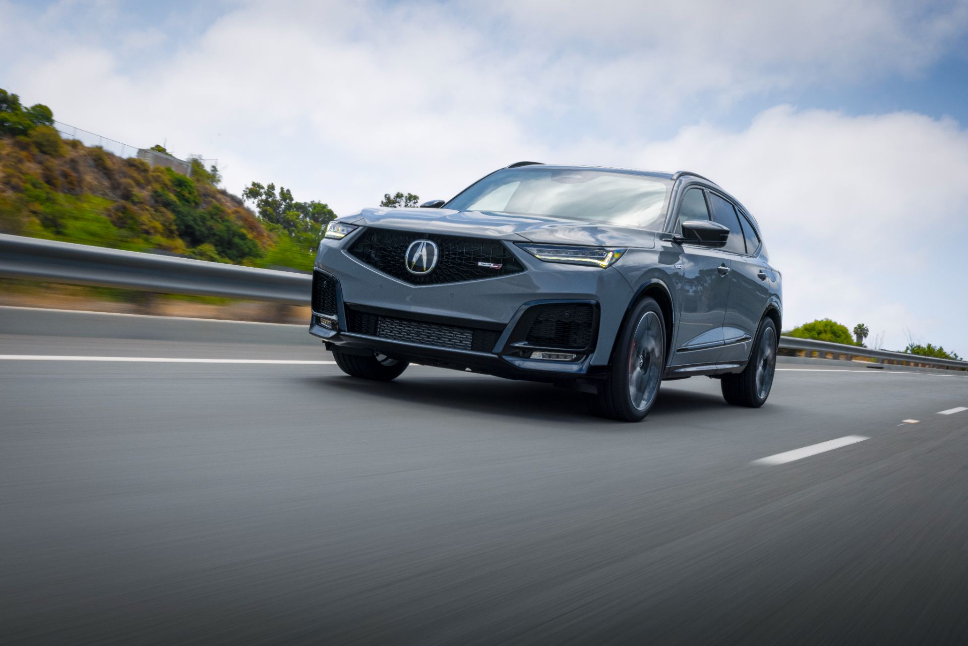 acura mdx type s driving front three quarter grey