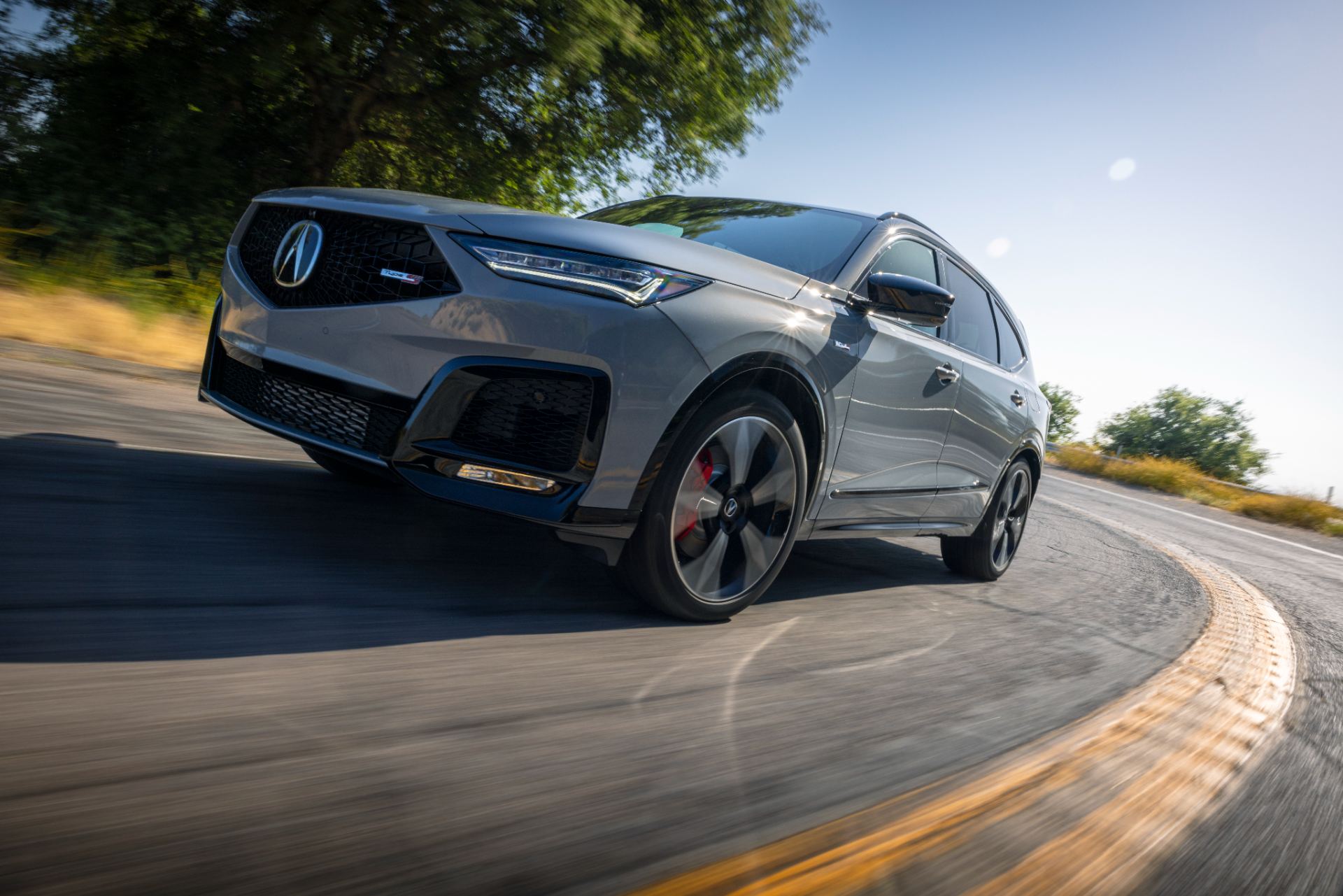acura mdx type s driving front three quarter low angle grey