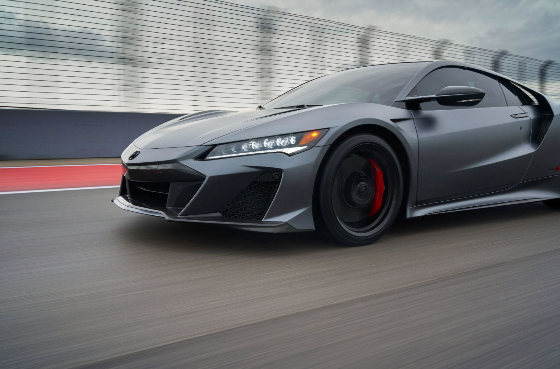 2022 acura nsx type s driving front three quarter track grey