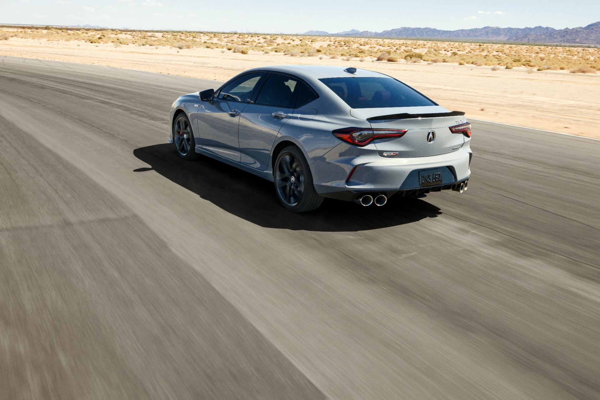 2024 acura tlx type s driving rear three quarter grey