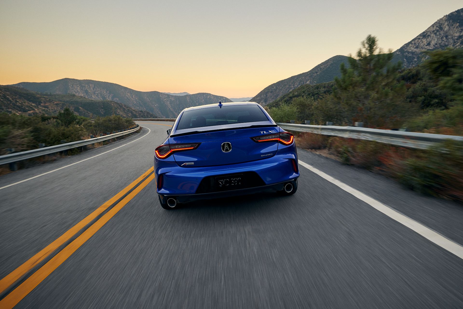 2024 acura tlx a spec driving rear mountain road blue