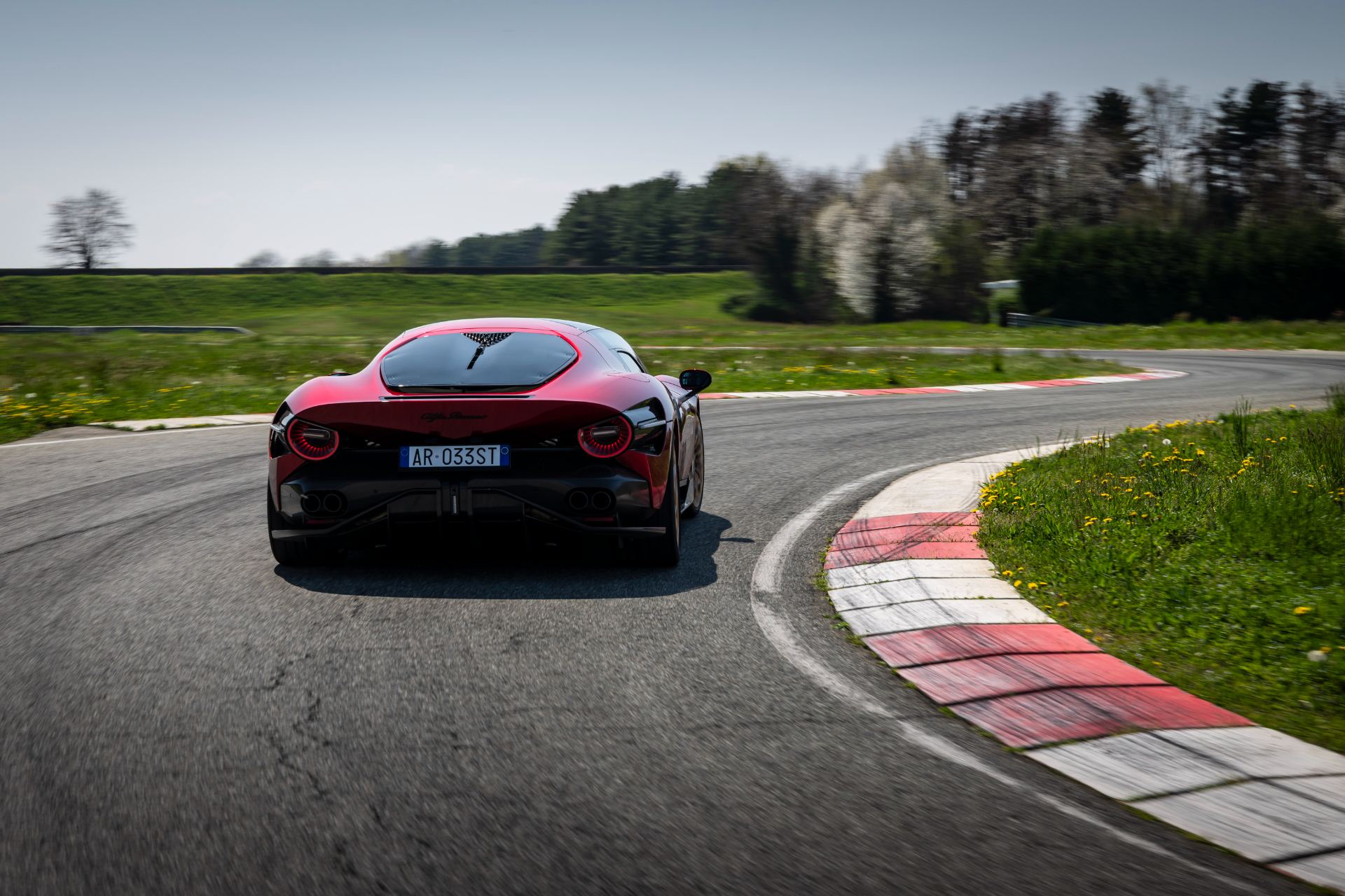 2024 alfa romeo 33 stradale driving rear track red