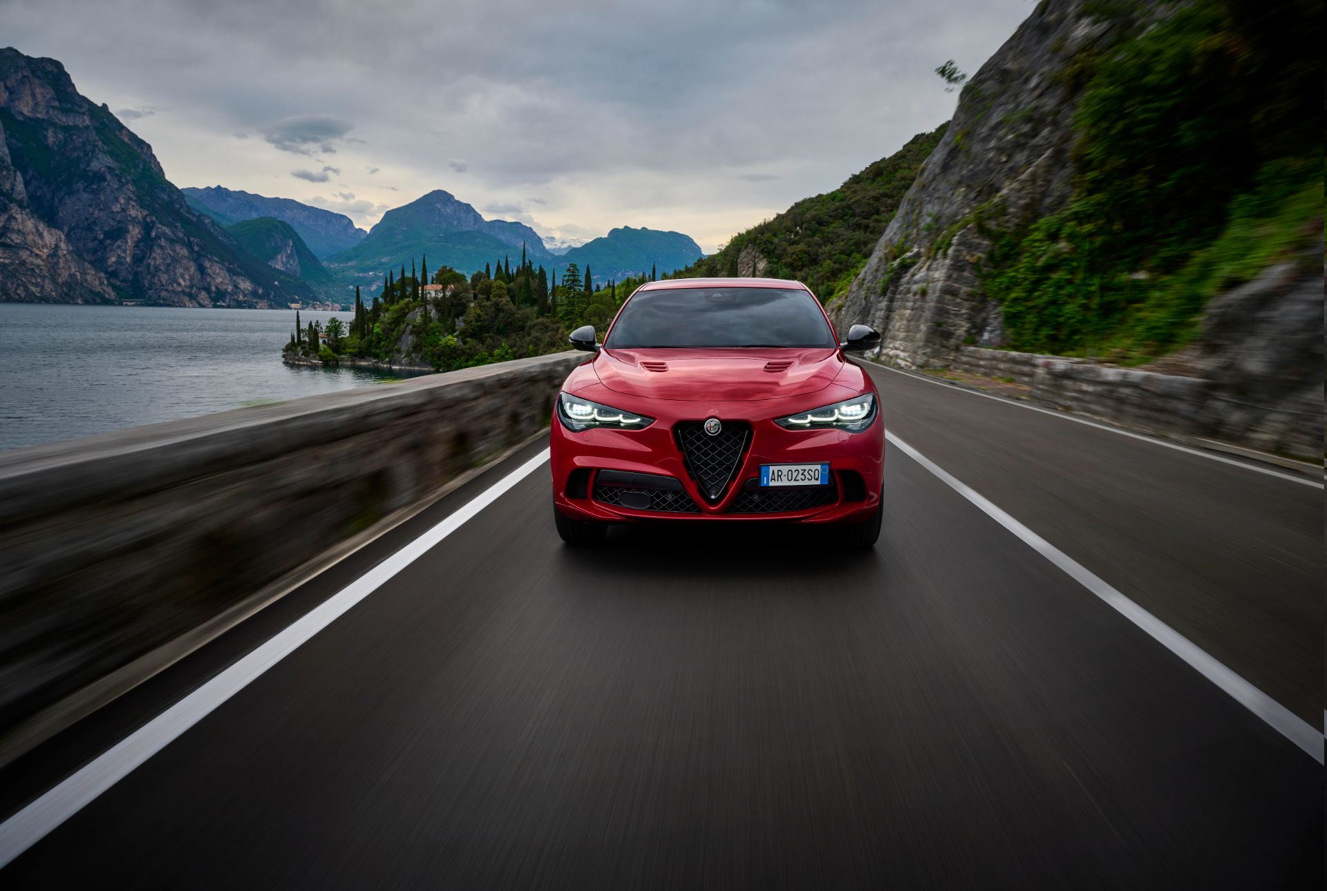 2026 alfa romeo stelvio quadrifoglio driving front lake road red