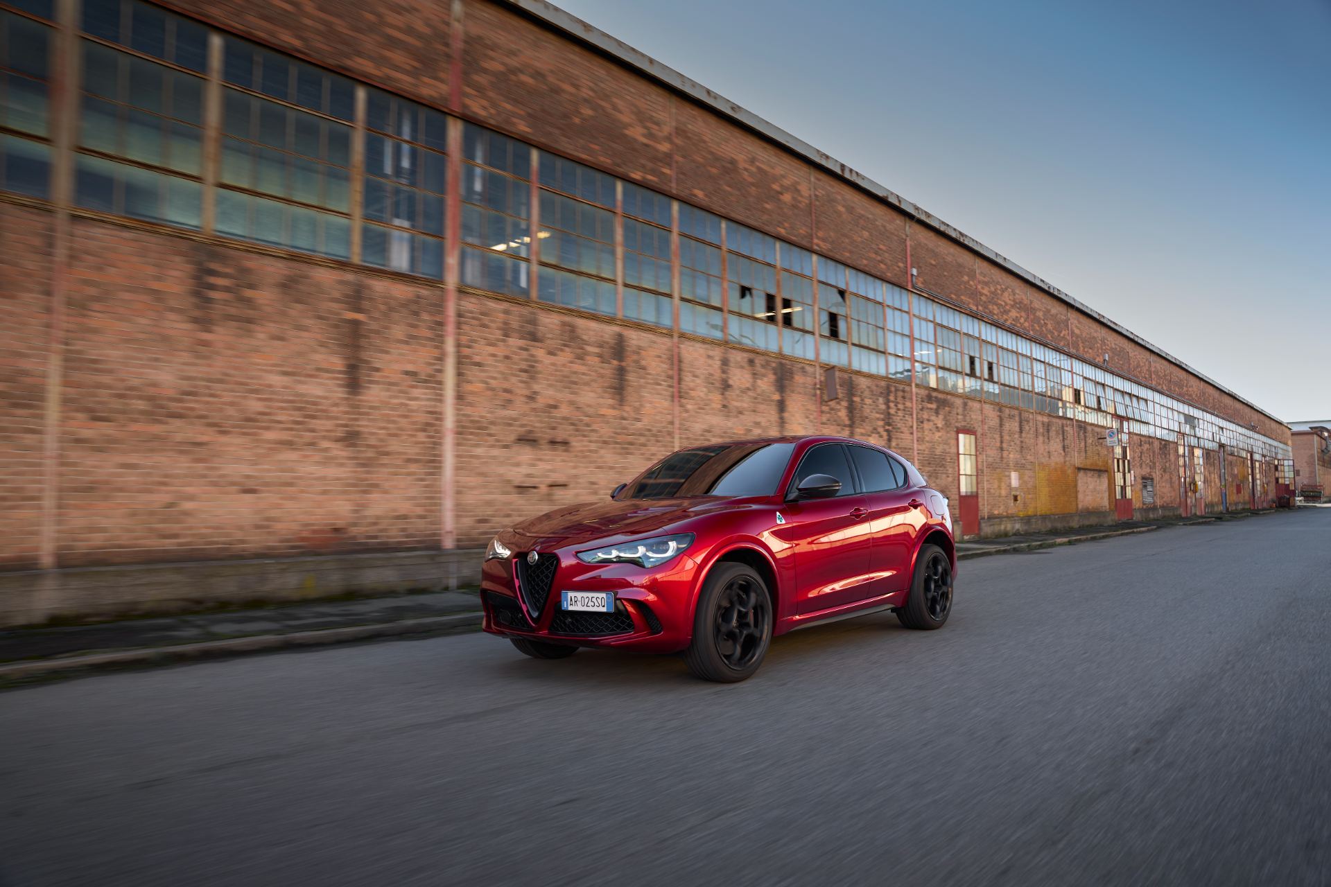 2026 alfa romeo stelvio quadrifoglio collezione driving front three quarter red