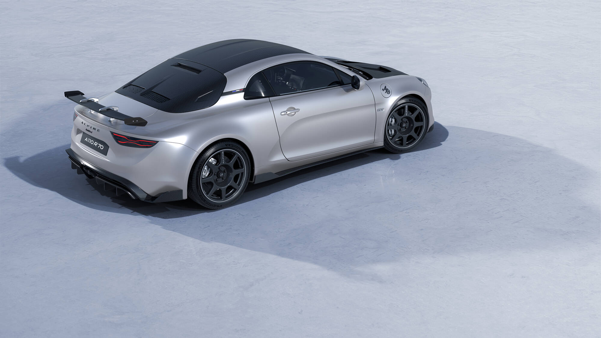 2026 alpine a110 r 70 rear three quarter high angle snow silver and black