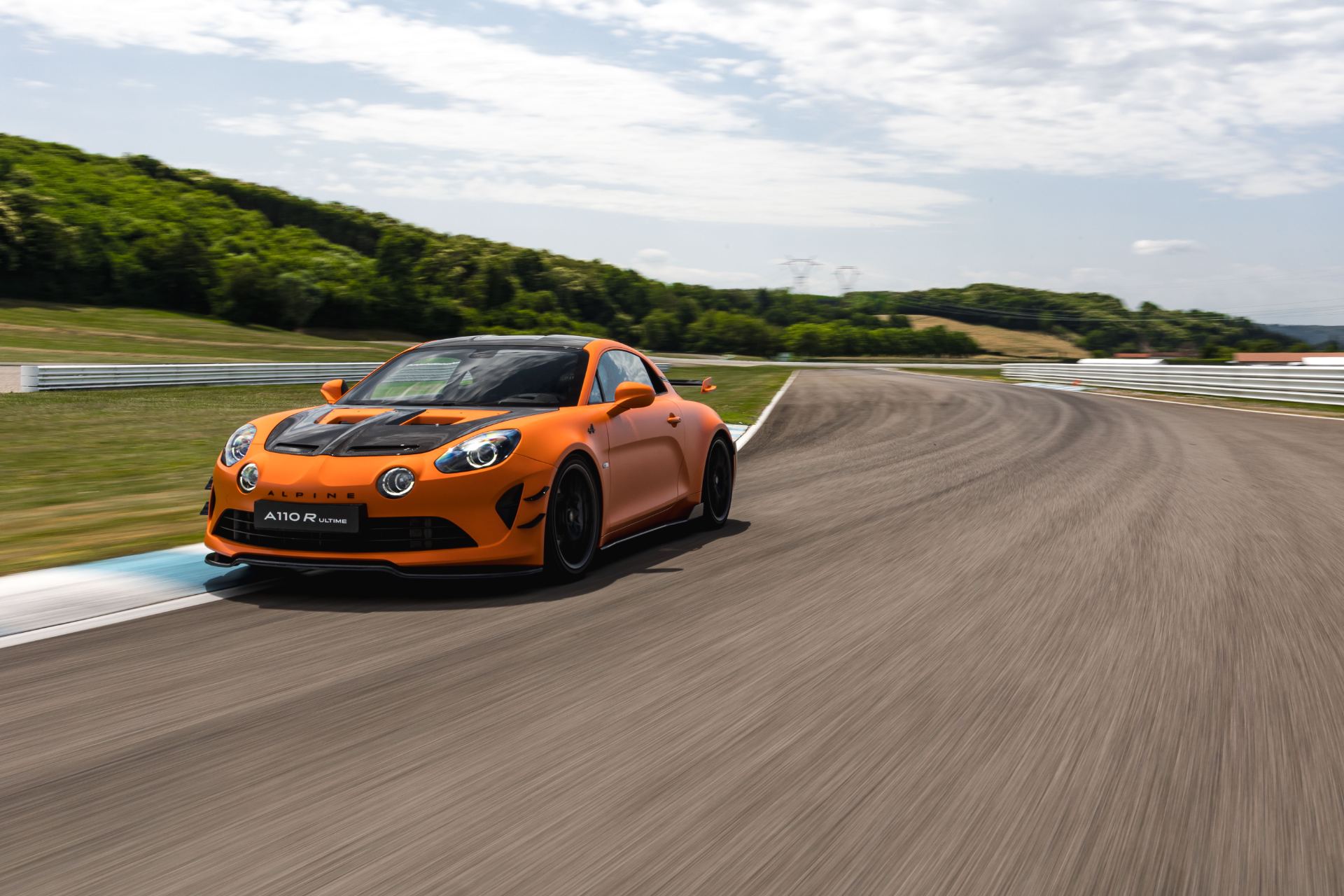 2026 alpine a110 r ultime driving front three quarter track orange