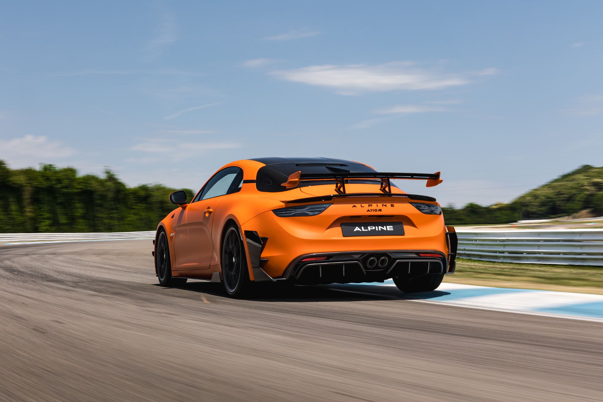 2026 alpine a110 r ultime driving rear three quarter track orange