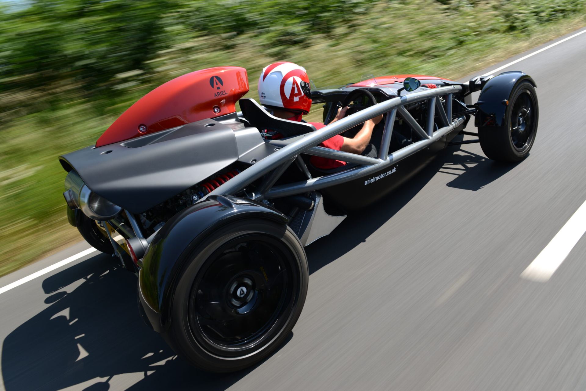 2026 ariel atom 4 driving rear three quarter orange