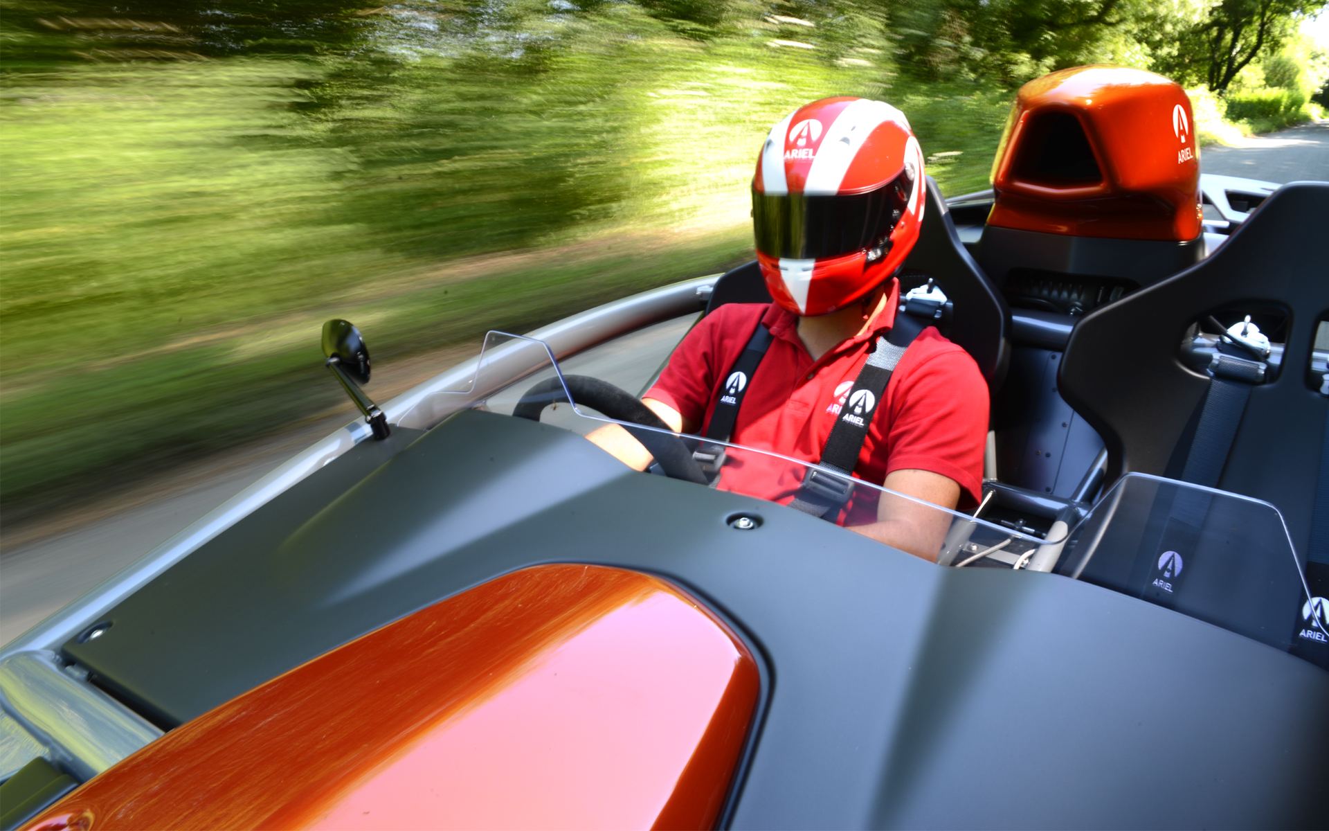 2026 ariel atom 4 driving driver view orange