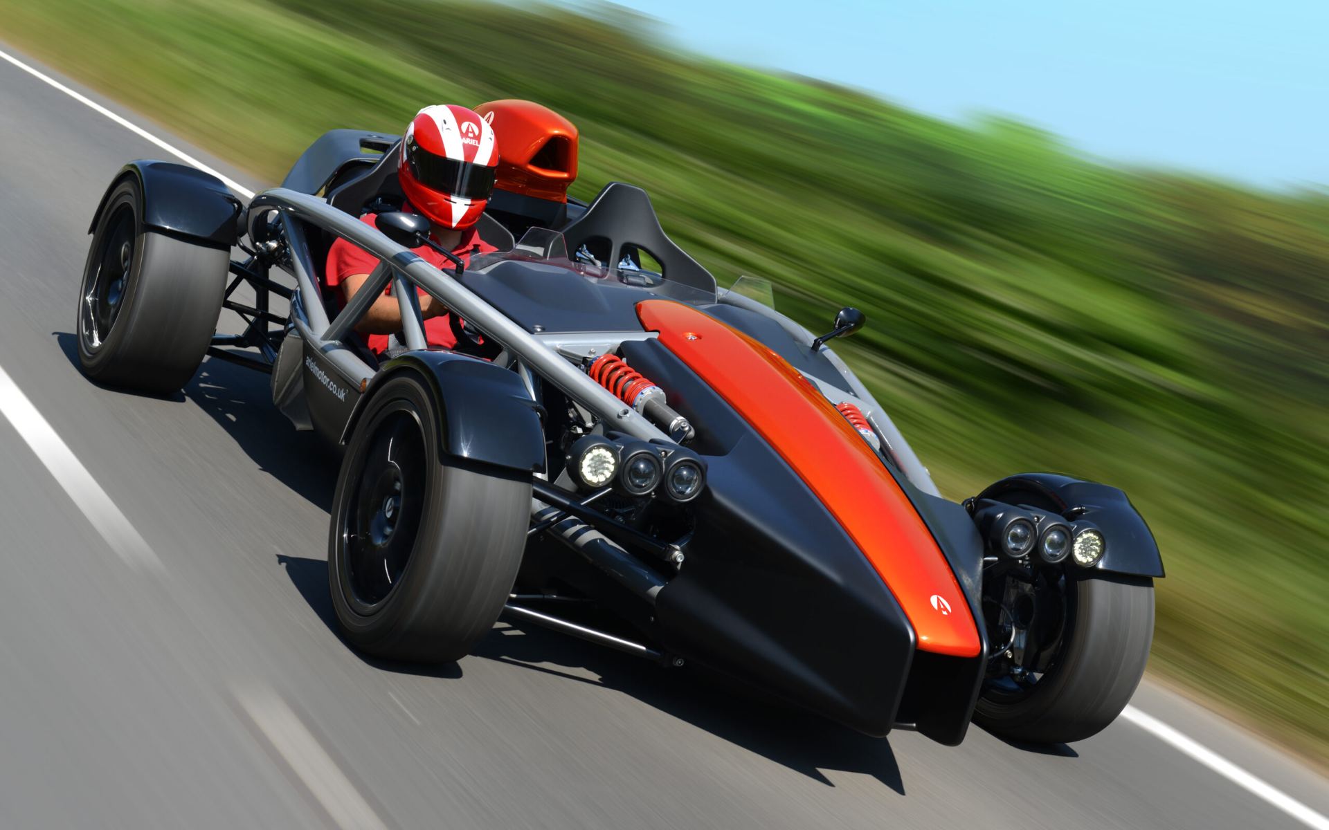 2026 ariel atom 4 driving front three quarter orange
