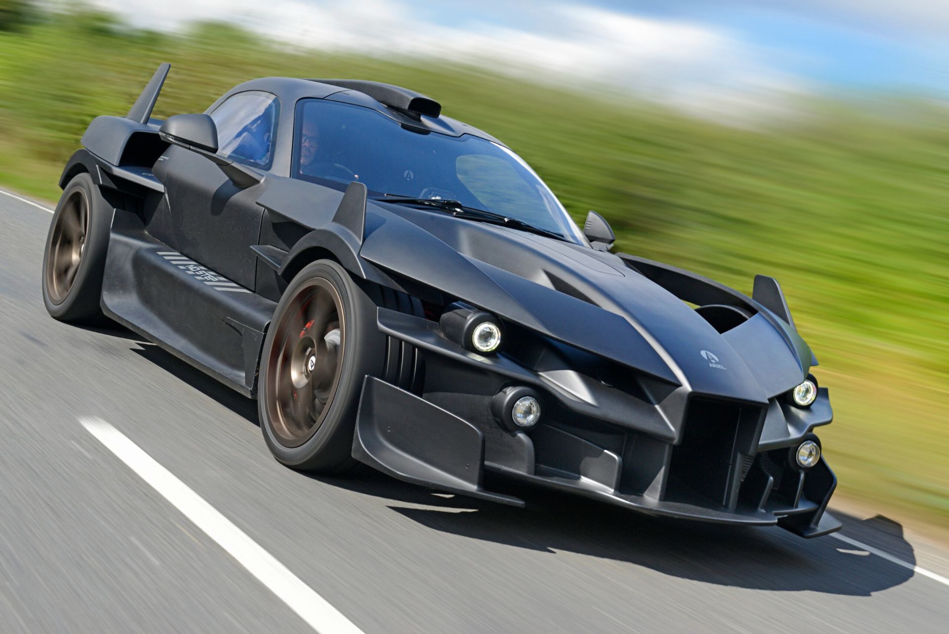 2026 ariel hipercar driving front three quarter black