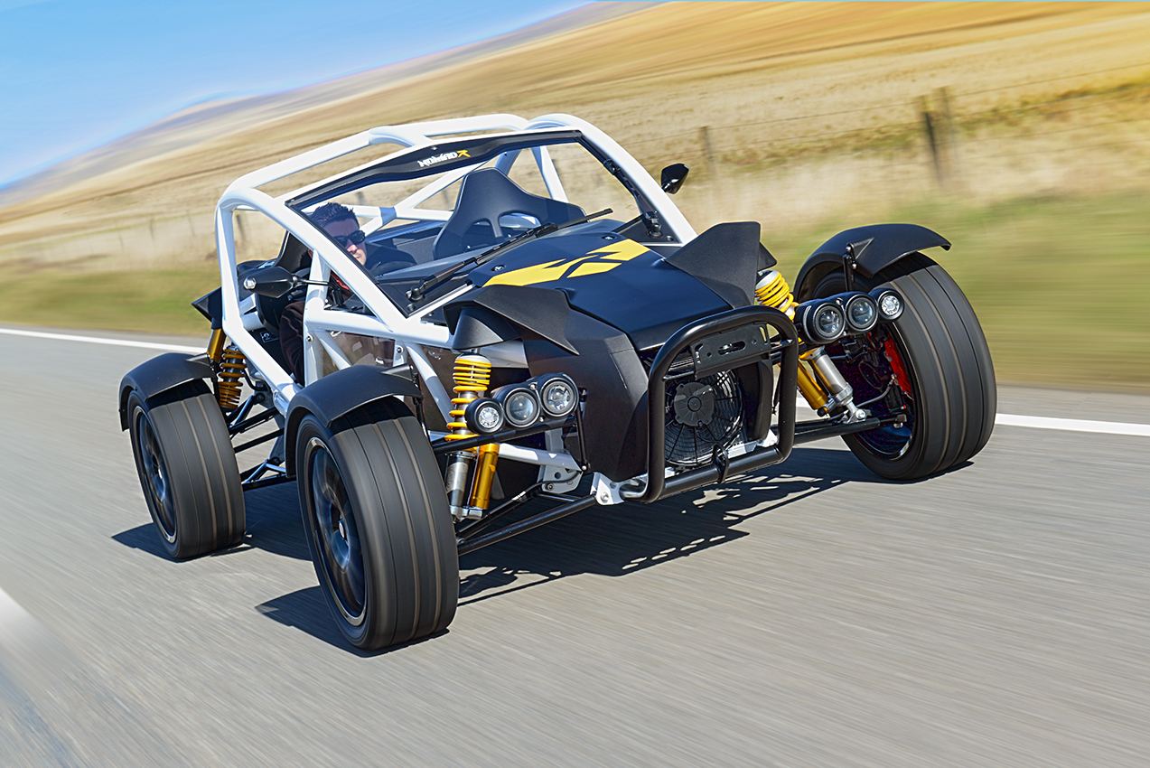 ariel nomad r driving front three quarter white and black