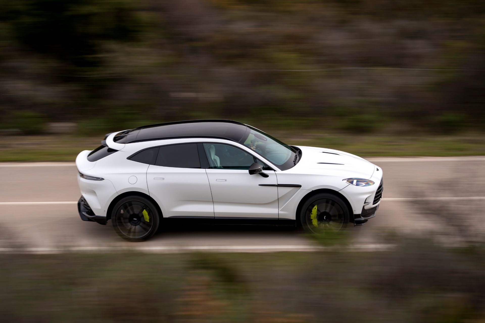 2026 aston martin dbx707 driving side profile panning white