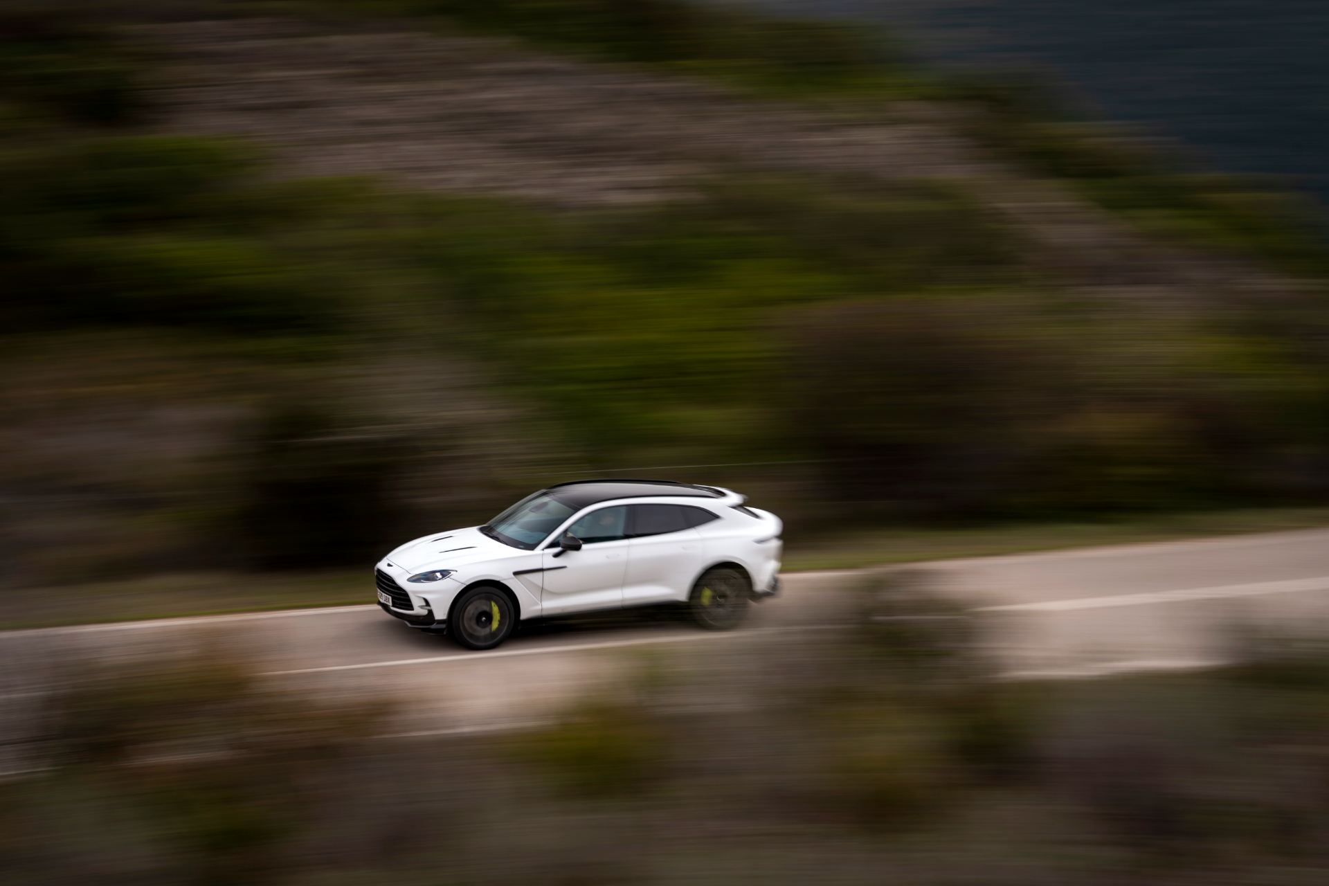2026 aston martin dbx707 driving distant side white