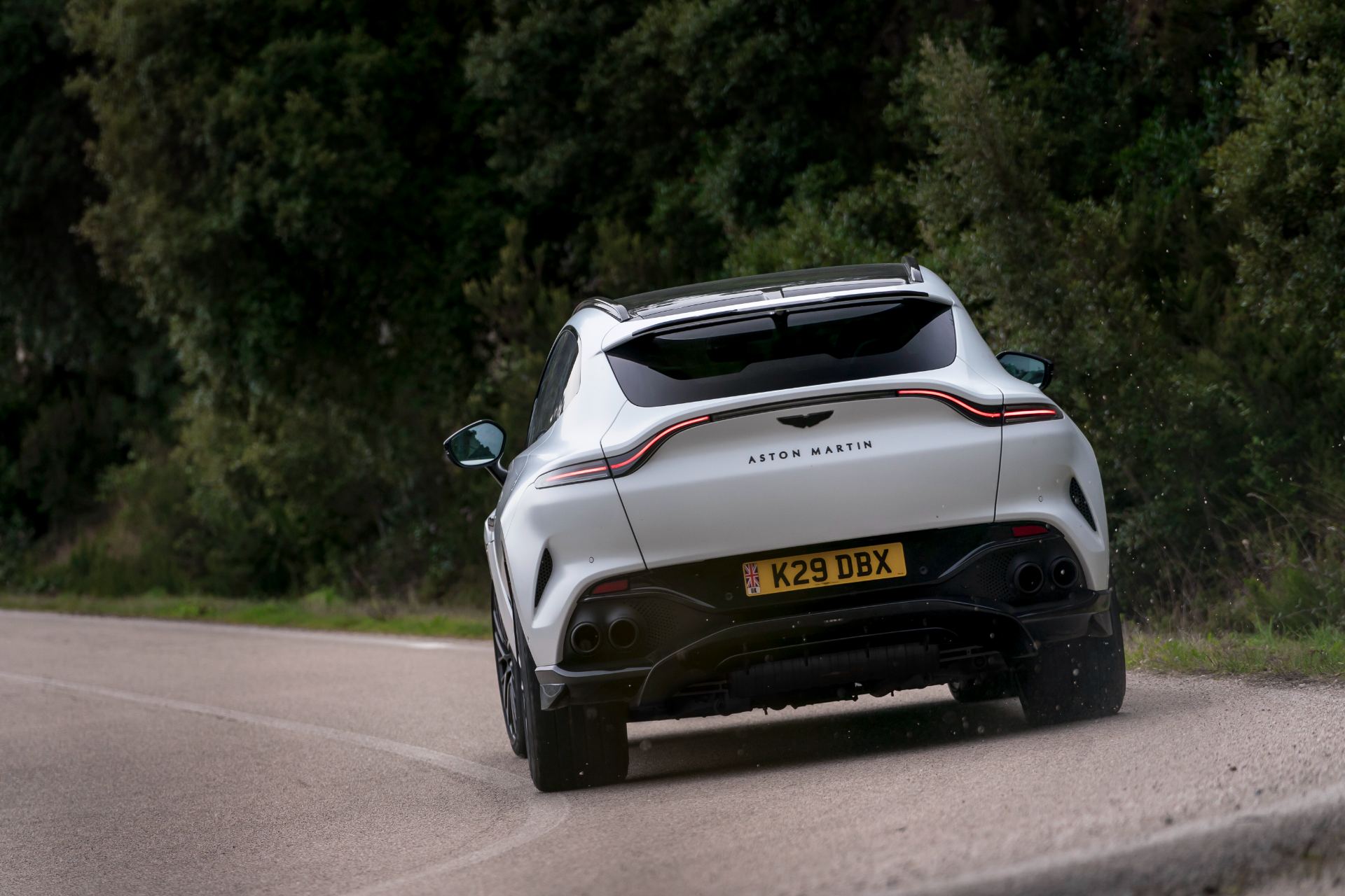 2026 aston martin dbx707 driving rear hairpin white