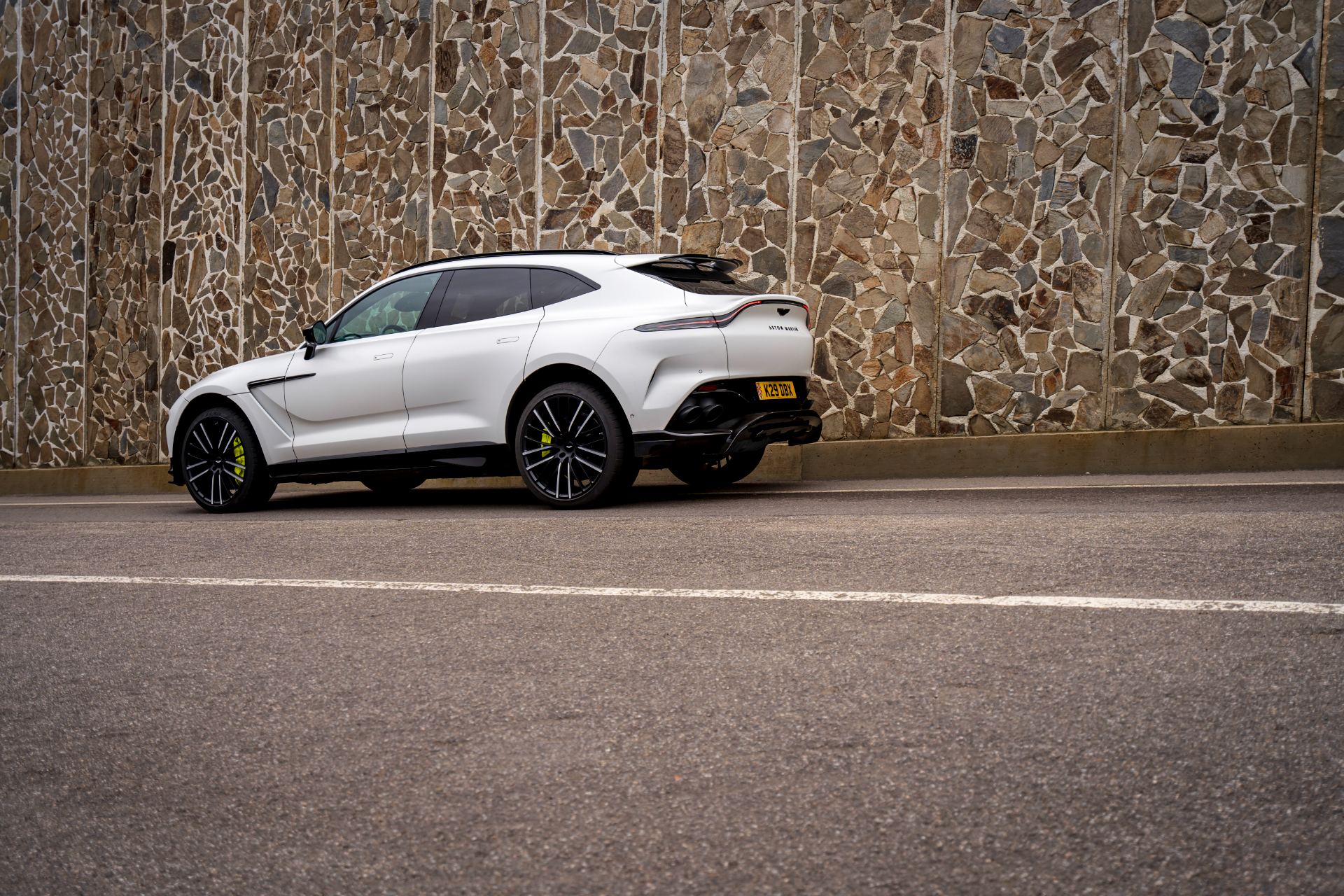 2026 aston martin dbx707 side rear stone wall white