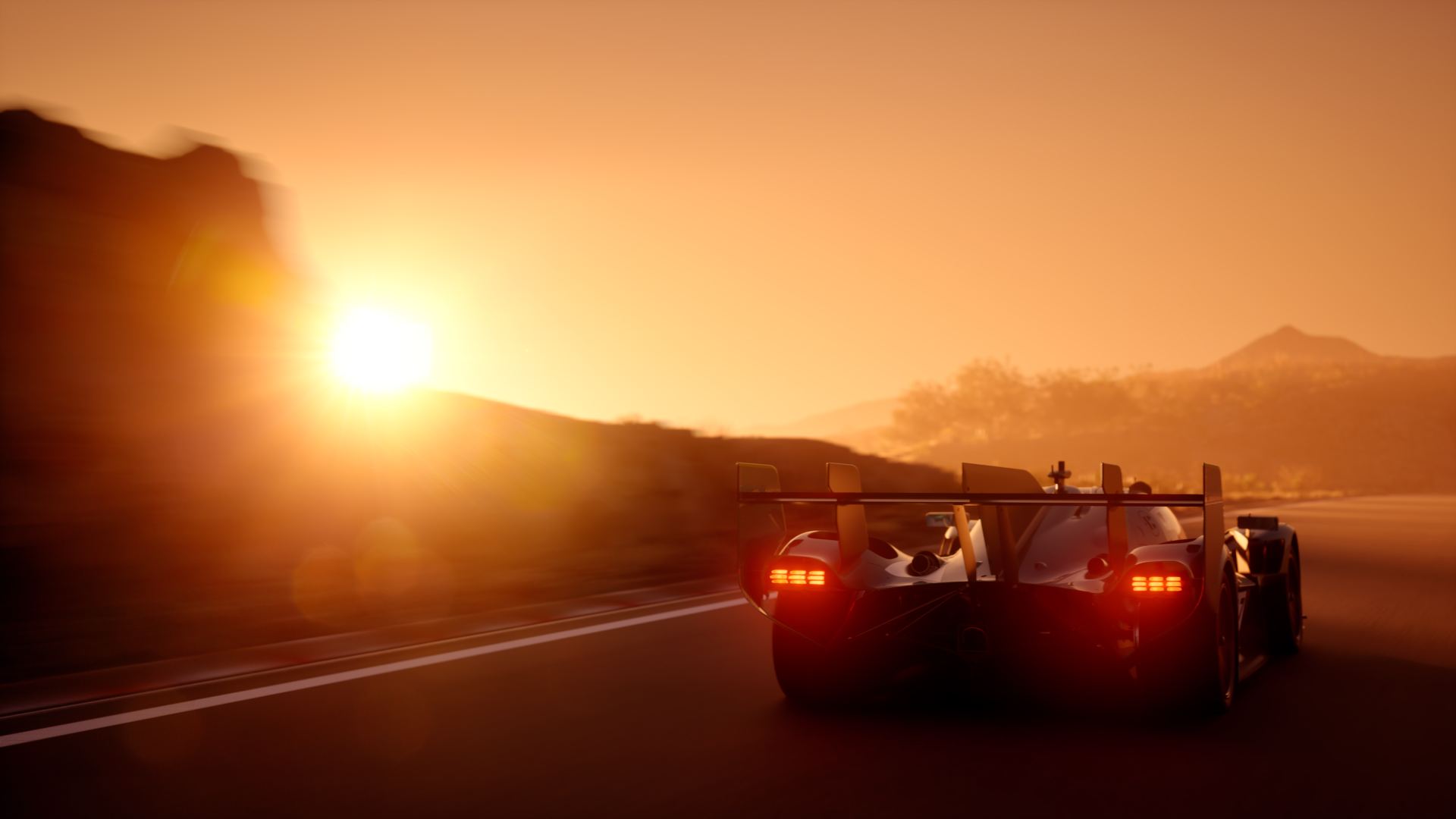 2026 aston martin valkyrie lm driving rear sunset