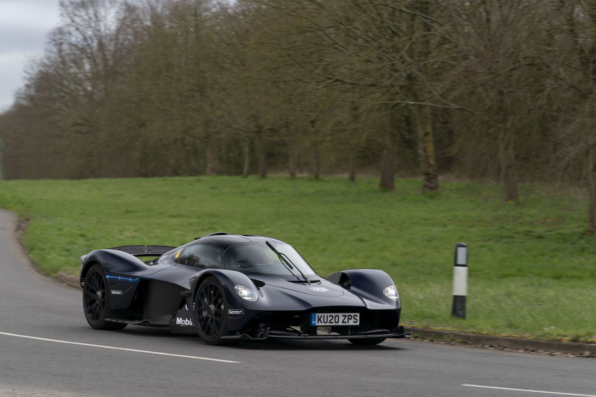 2026 aston martin valkyrie front three quarter roadside dark blue