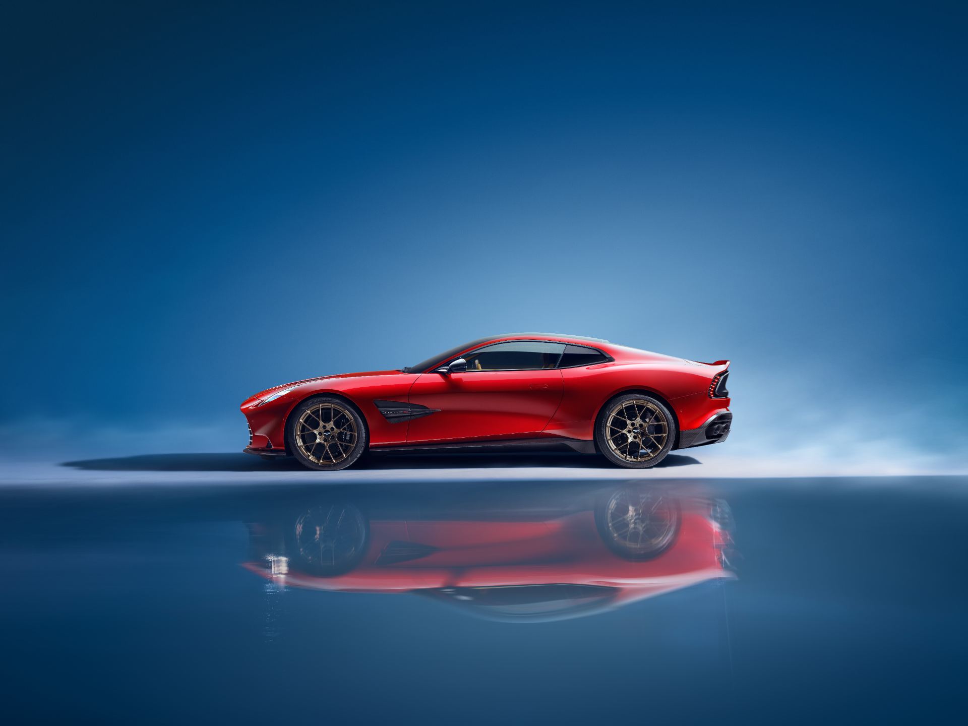2026 aston martin vanquish side profile studio red