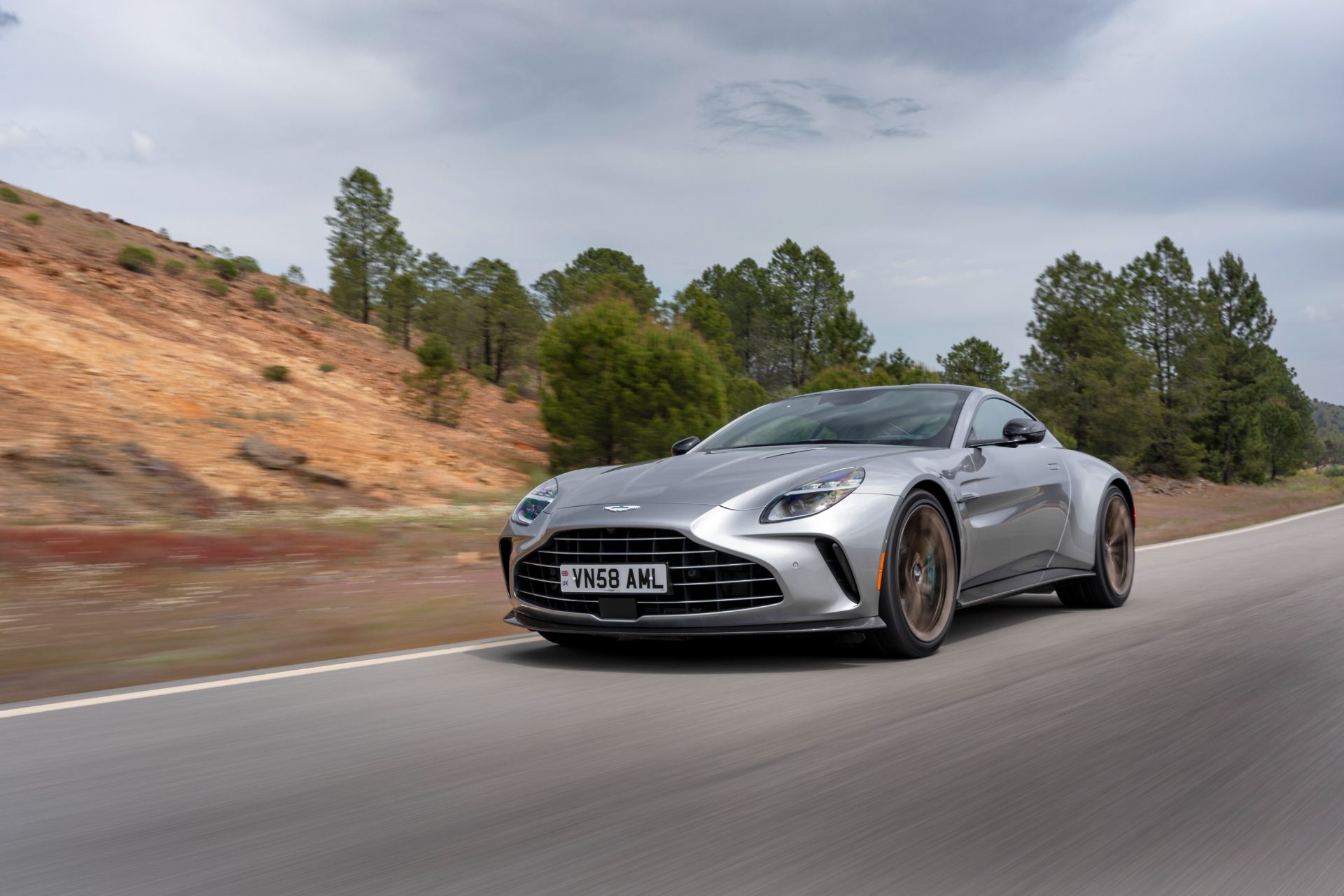 2026 aston martin vantage driving front three quarter silver