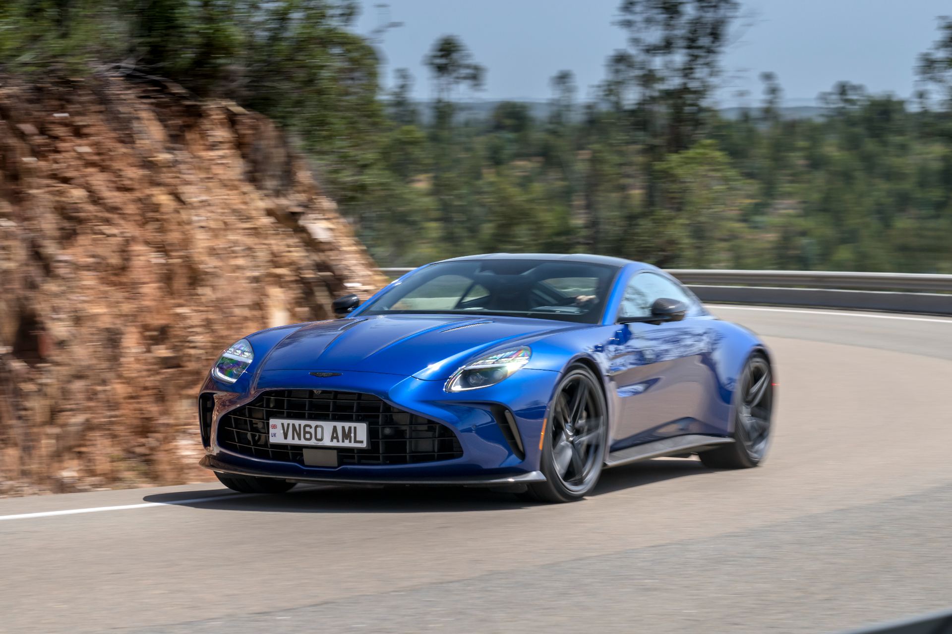 2026 aston martin vantage driving front three quarter ion blue