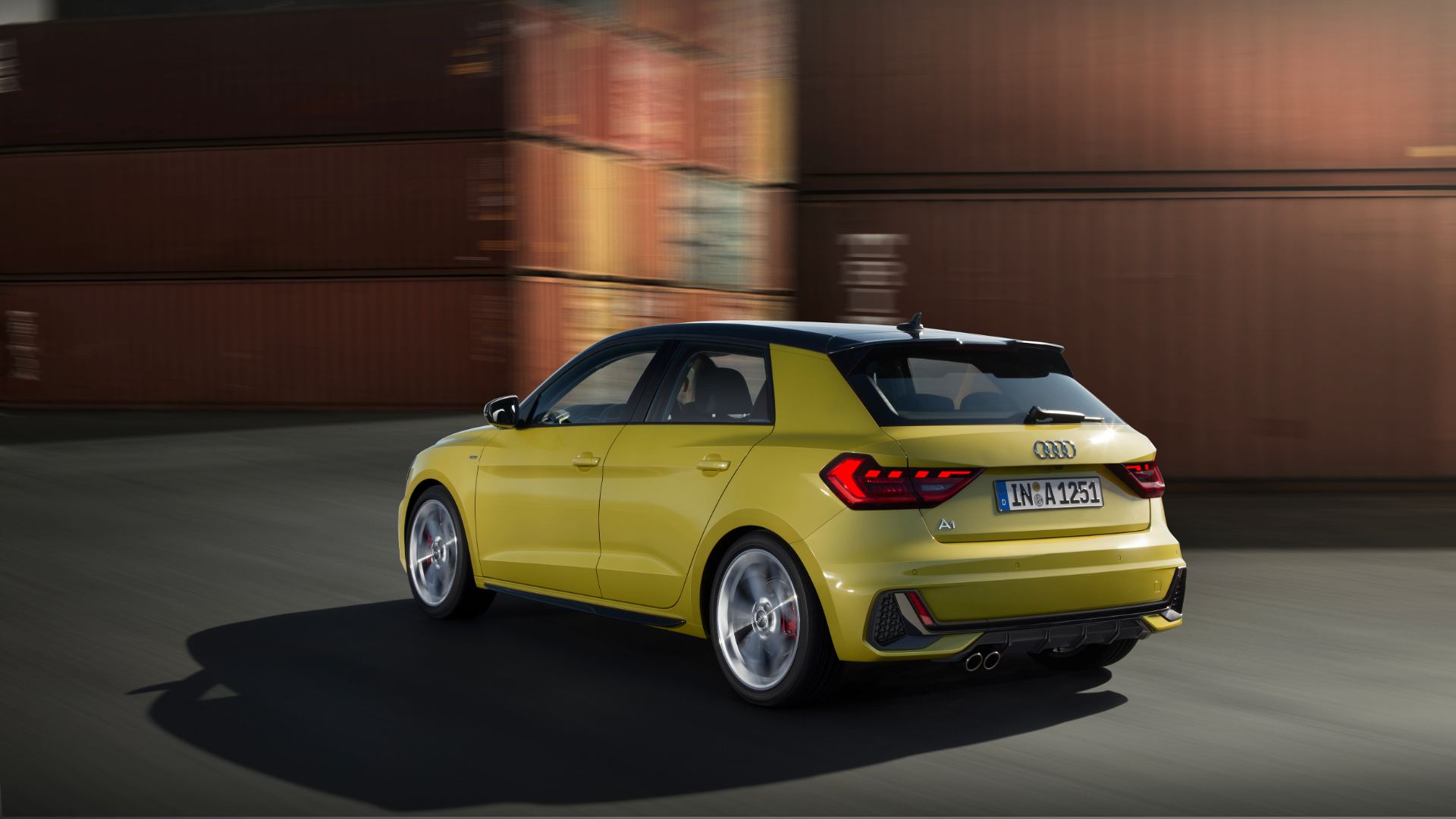 2026 audi a1 sportback driving rear three quarter containers yellow