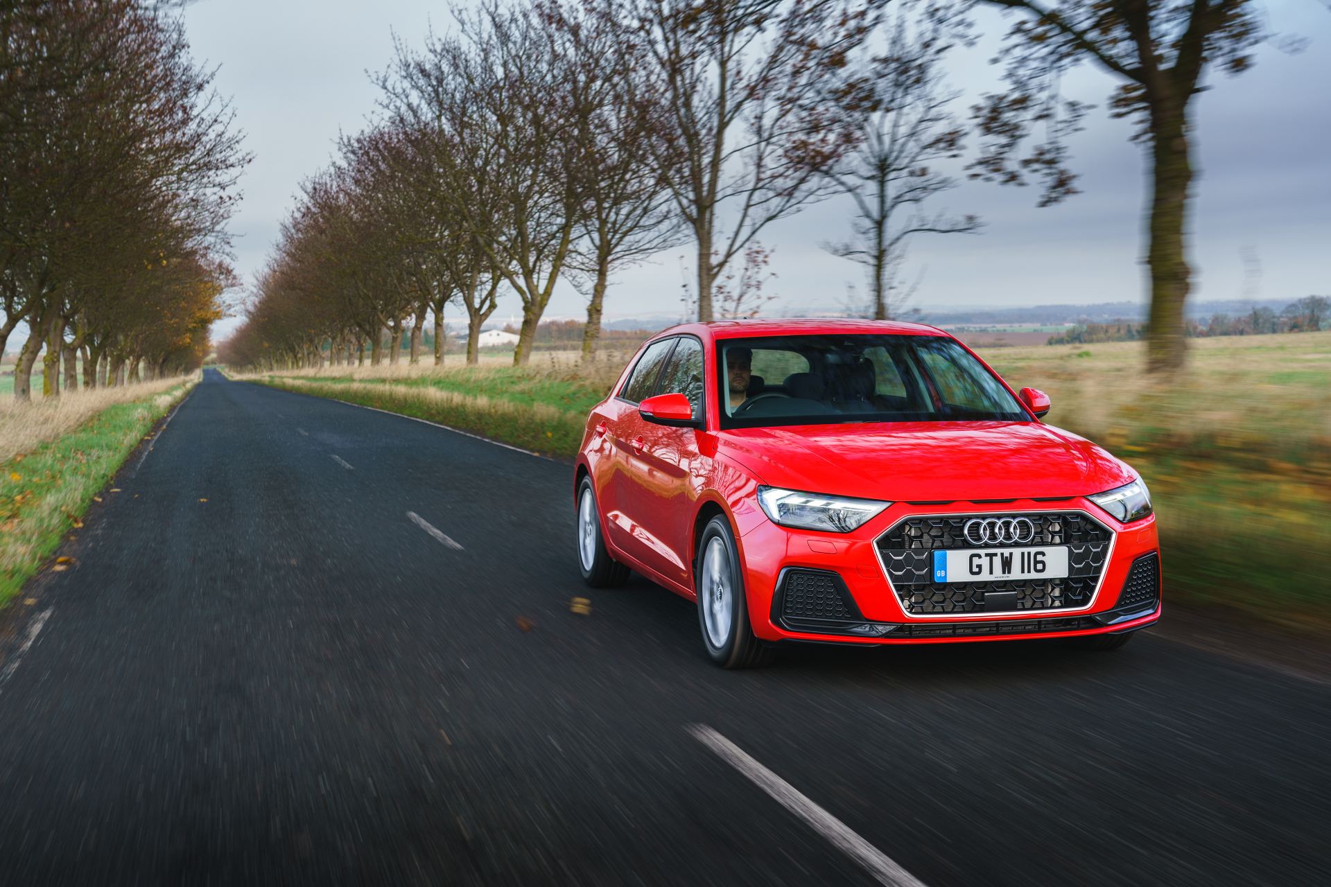 2026 audi a1 sportback sport driving front three quarter avenue red