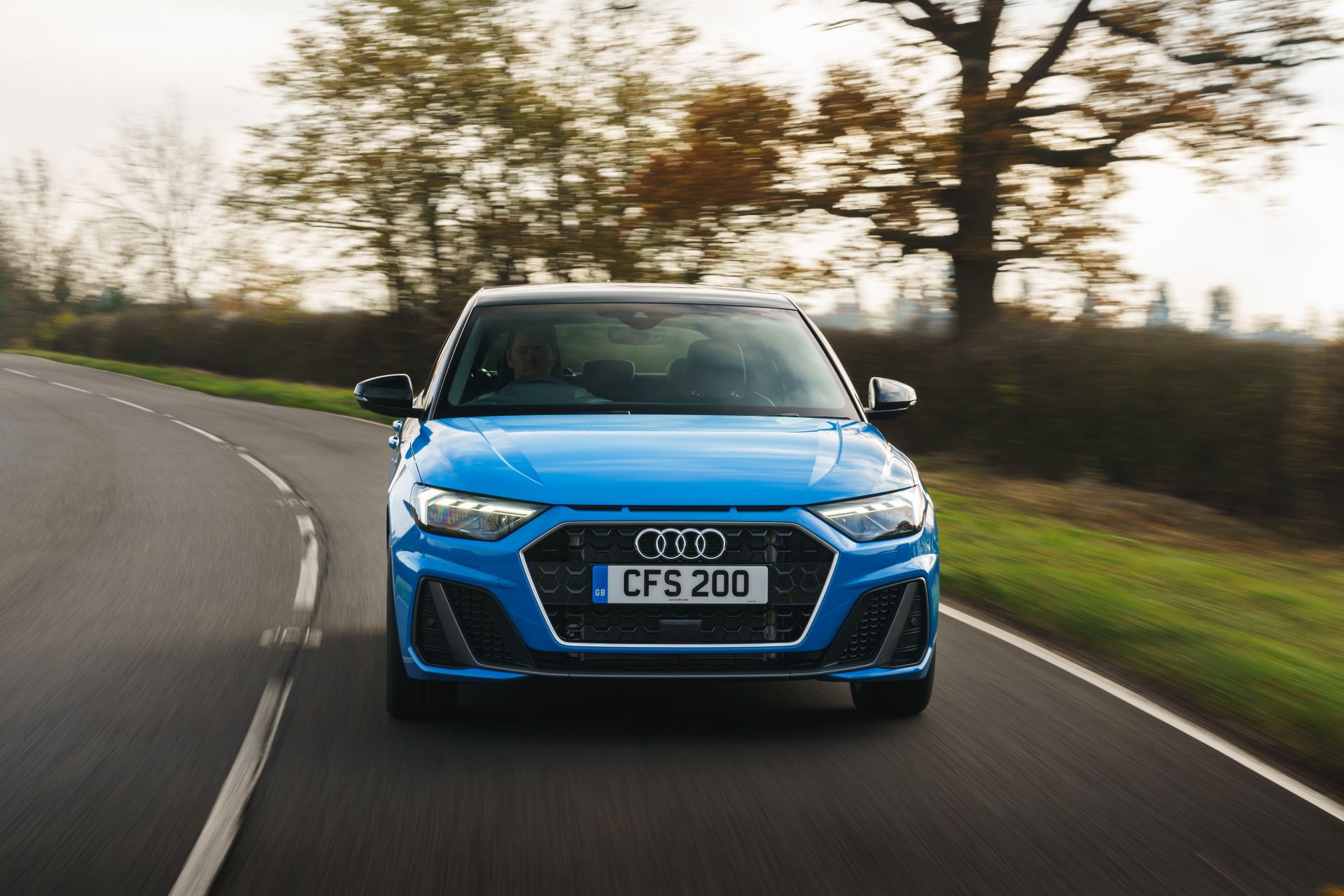 2026 audi a1 sportback s line driving front bend blue