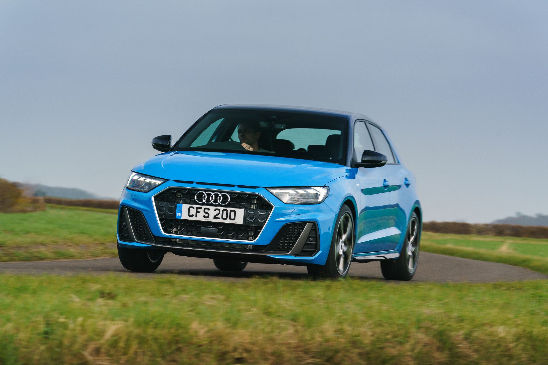 2026 audi a1 sportback s line driving front three quarter blue
