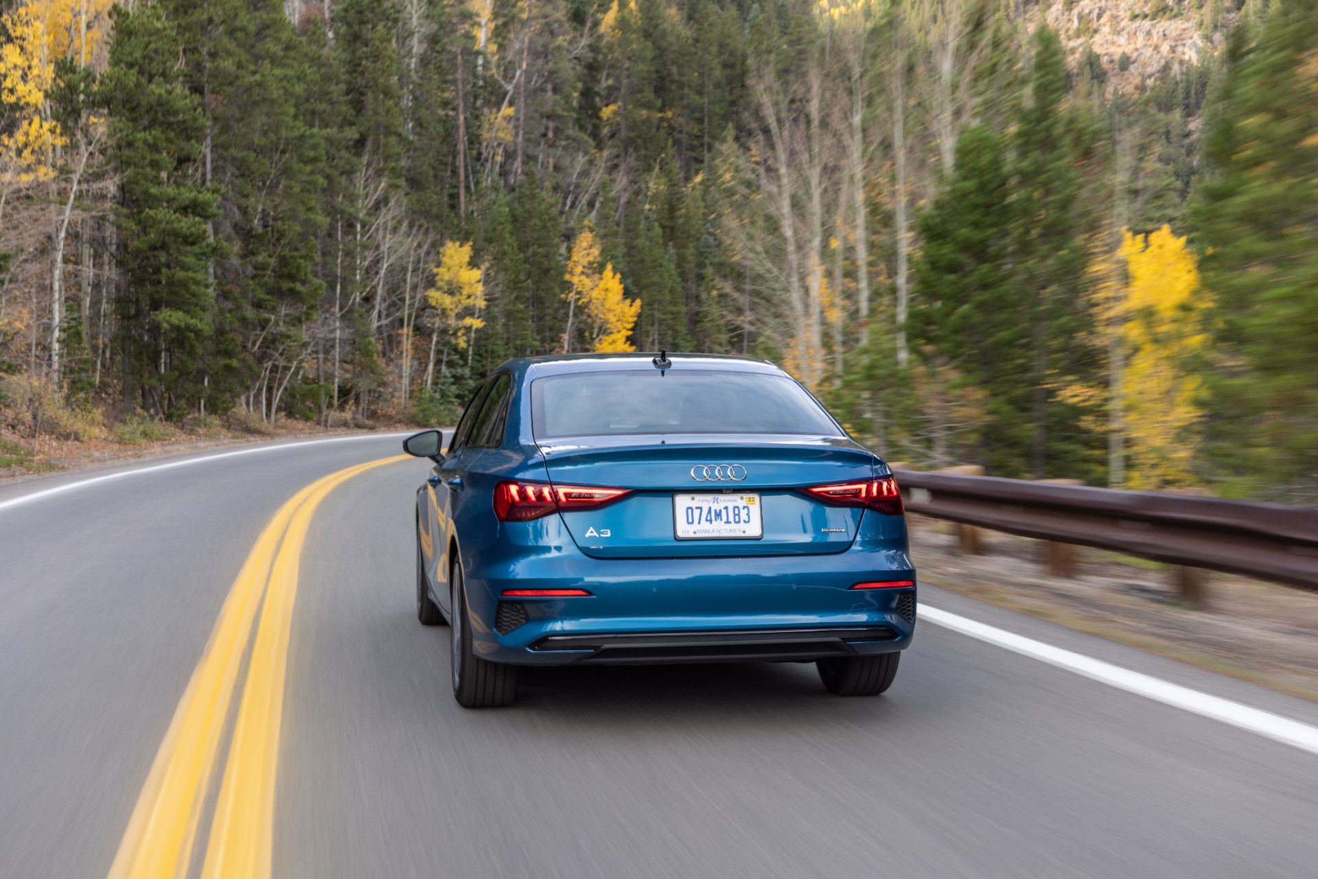 audi a3 driving rear mountain road atoll blue