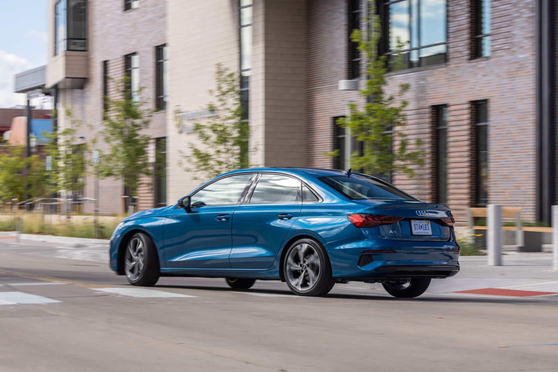 audi a3 driving rear three quarter atoll blue