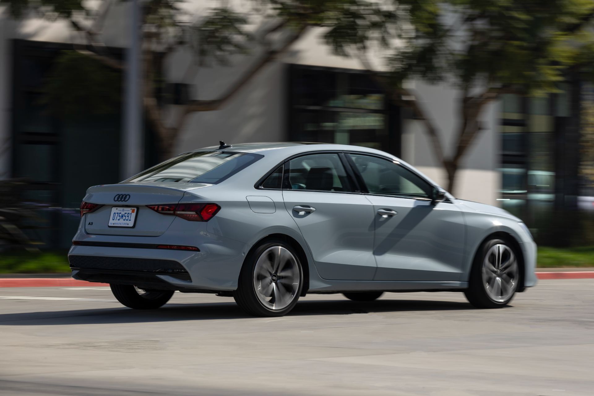 2026 audi a3 driving rear three quarter grey