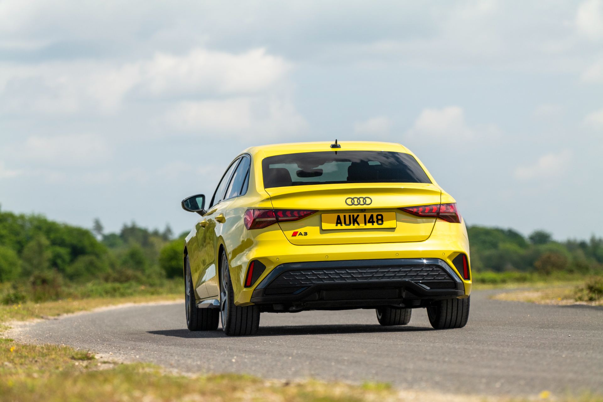 2025 audi a3 saloon driving rear yellow