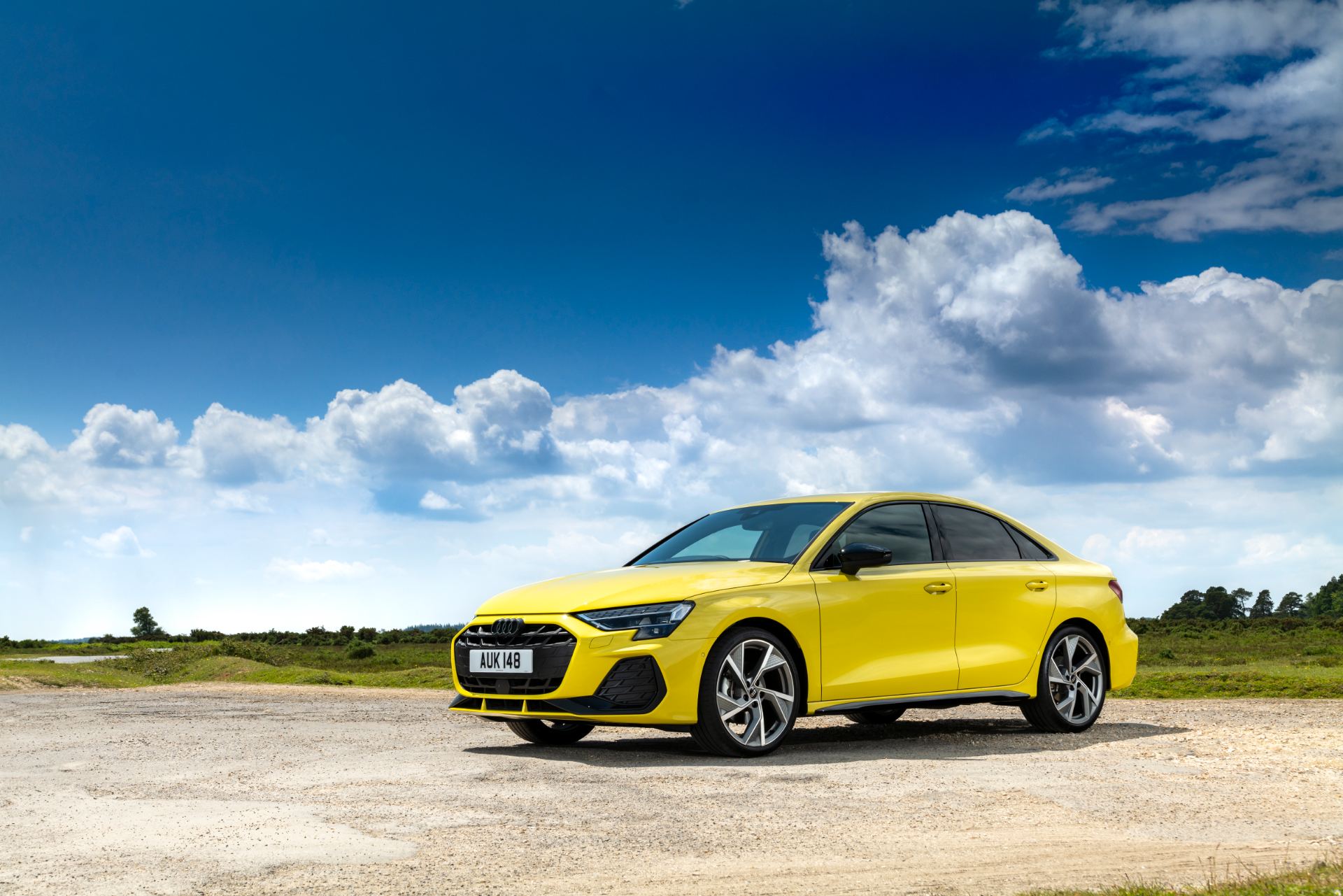2025 audi a3 saloon front three quarter clouds yellow