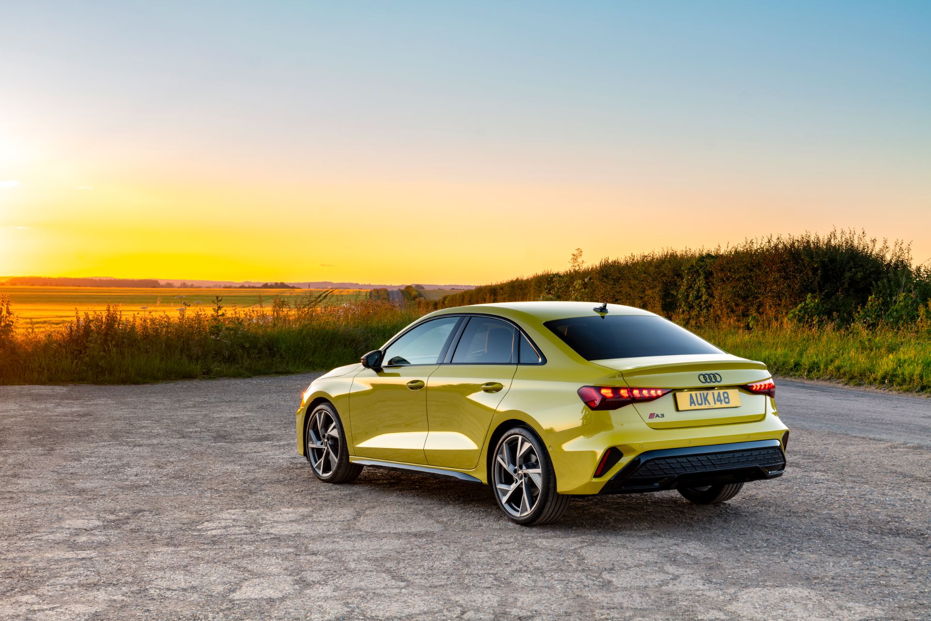2025 audi a3 saloon rear three quarter sunset yellow