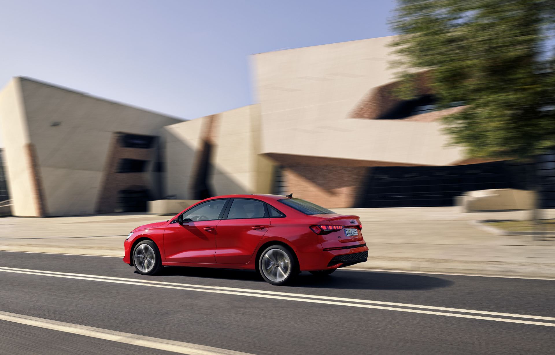 2025 audi a3 saloon driving rear three quarter red