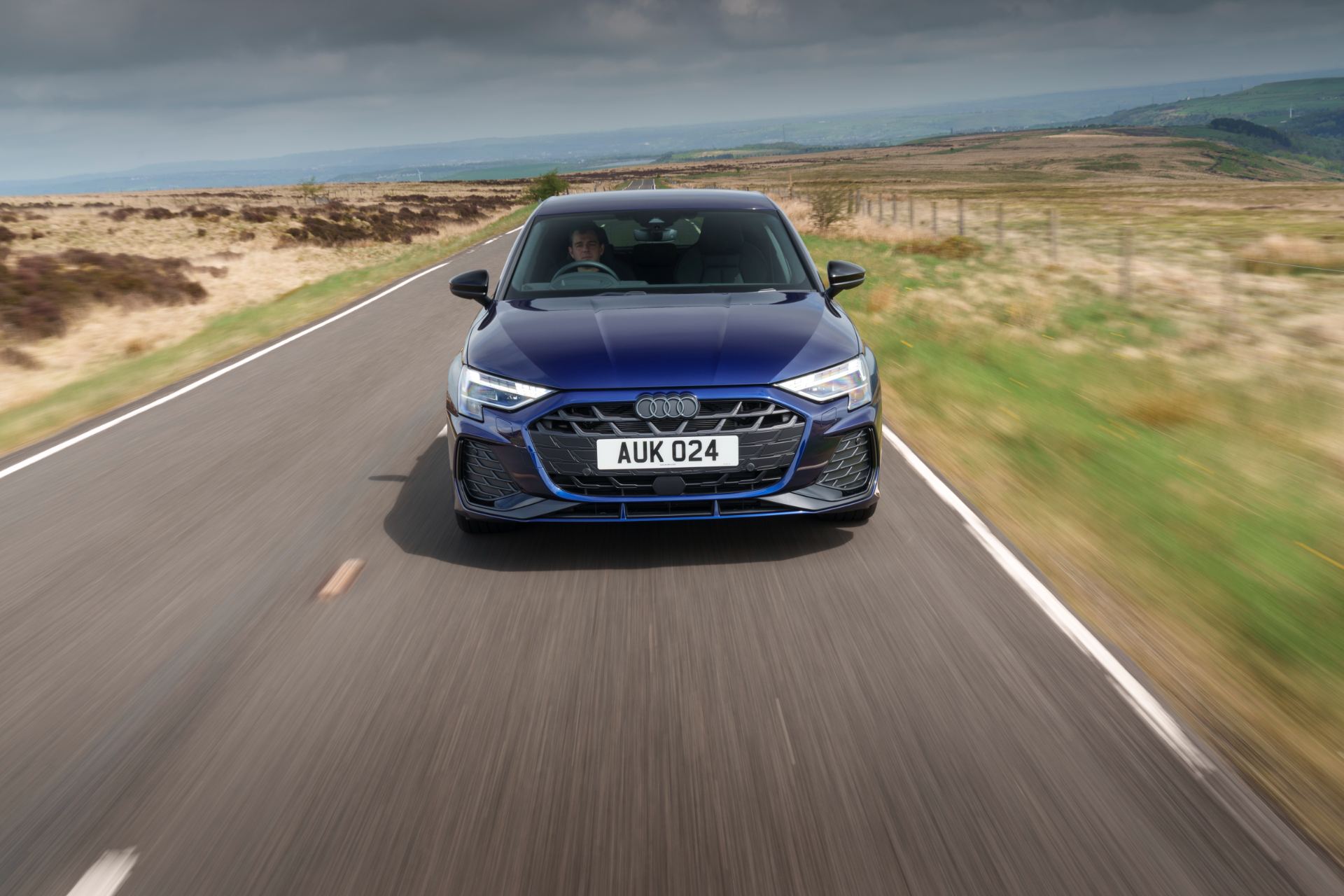 2025 audi a3 sportback driving front moorland blue